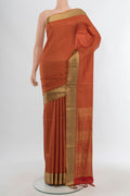 Rust Soft Silk Saree with Jacquard design on the body and Thread Border.  displayed on a mannequin