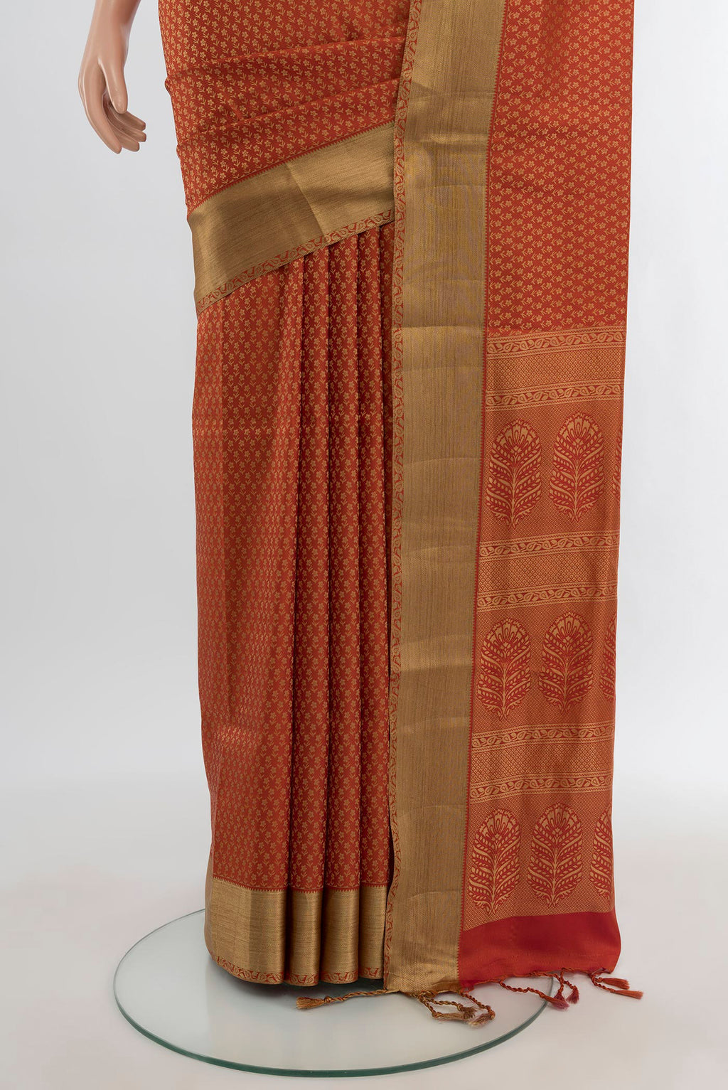 Pleats and pallu of Rust Soft Silk Saree with Jacquard design on the body and Thread Border. 