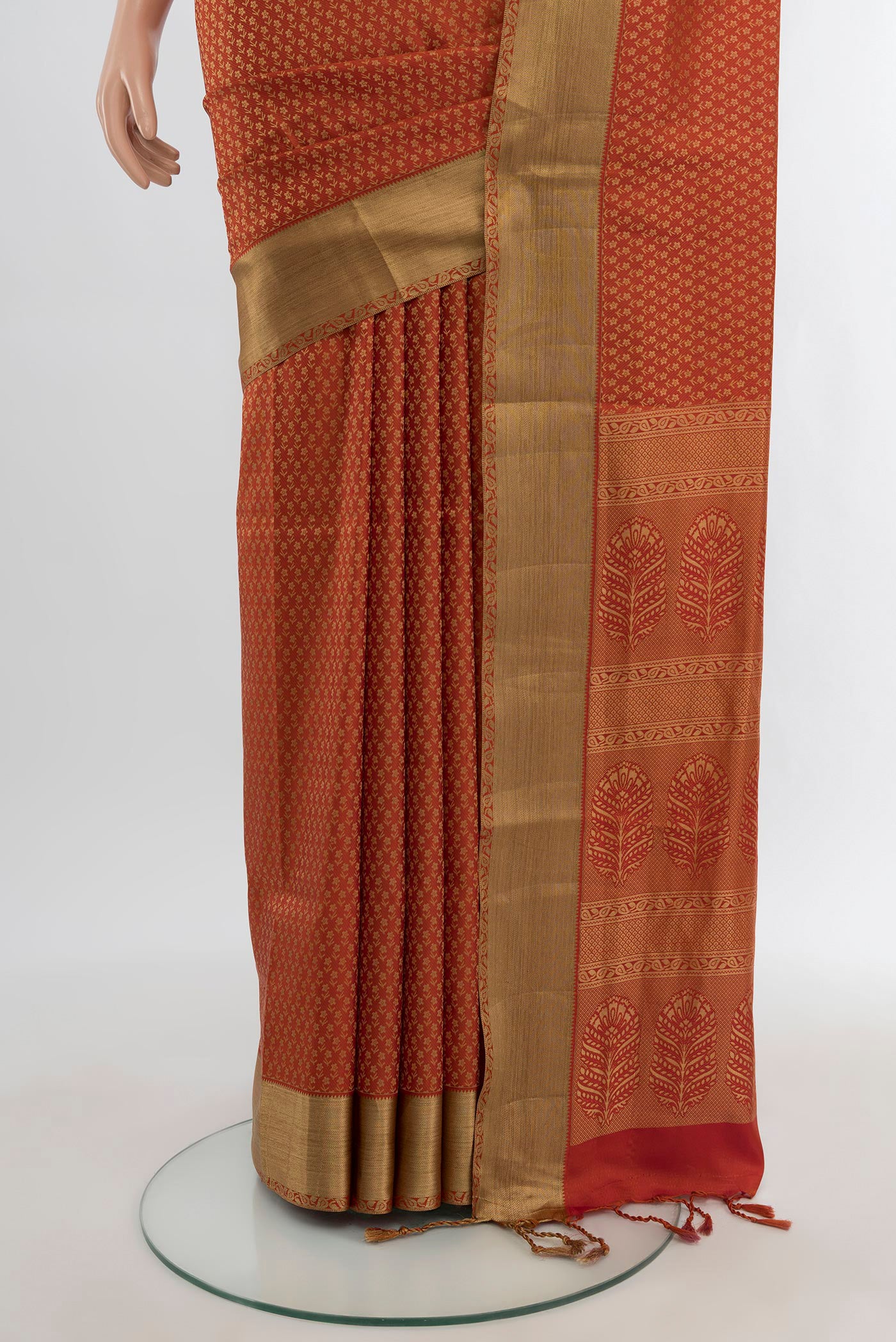 Pleats and pallu of Rust Soft Silk Saree with Jacquard design on the body and Thread Border. 