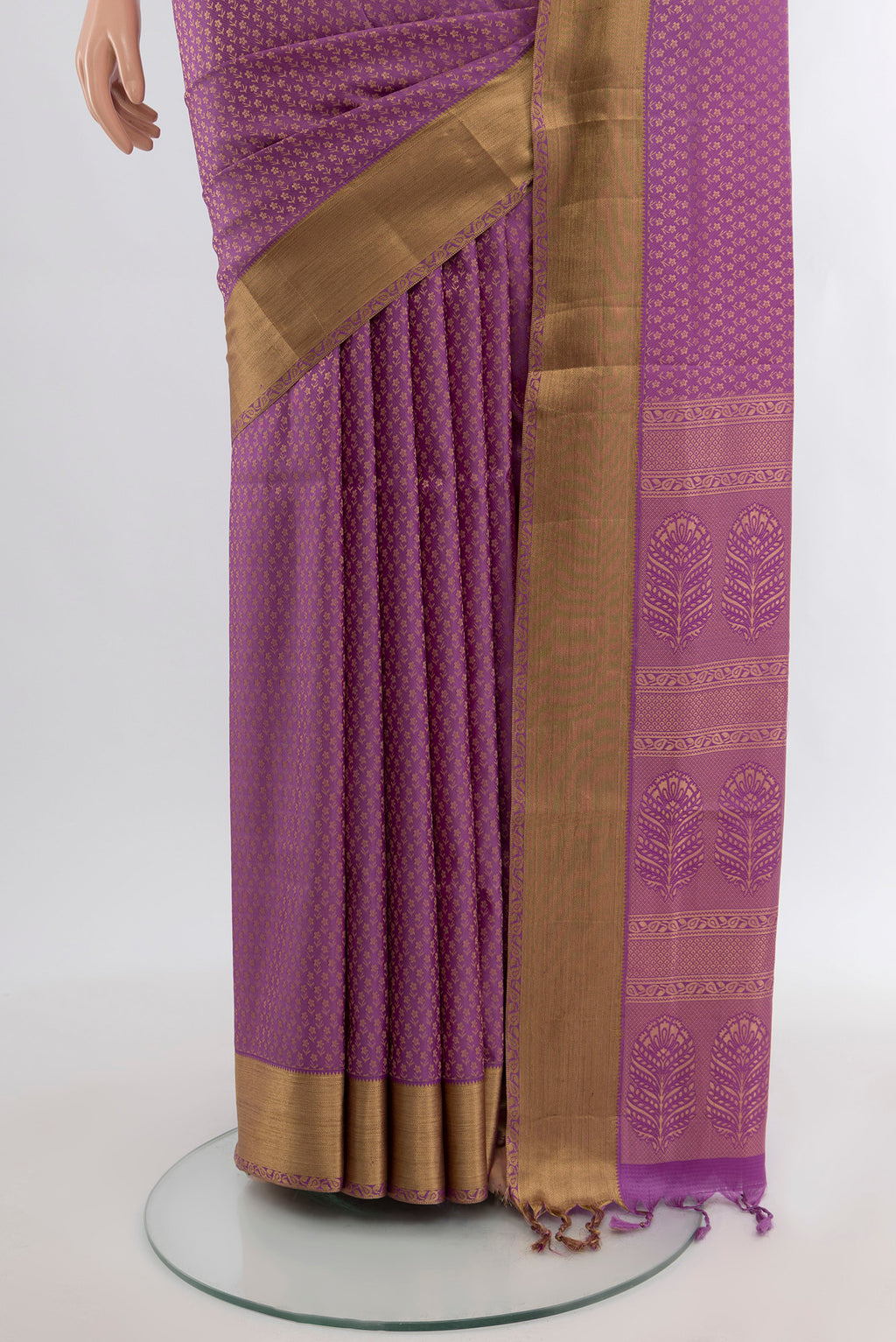 Pleats and pallu of Purple Soft Silk Saree with Zari Butta on the body and Zari Border. 