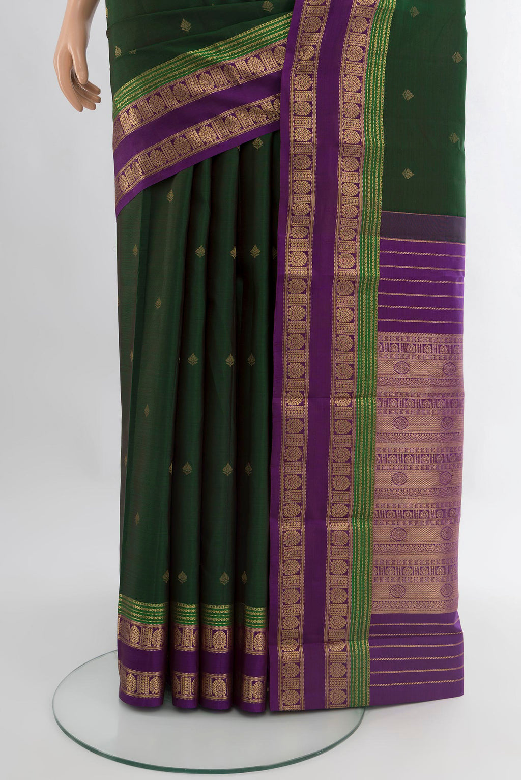 Pleats and pallu of Bottle Green Kanchipuram Silk Saree with Zari Butta on the body and Zari Border. 