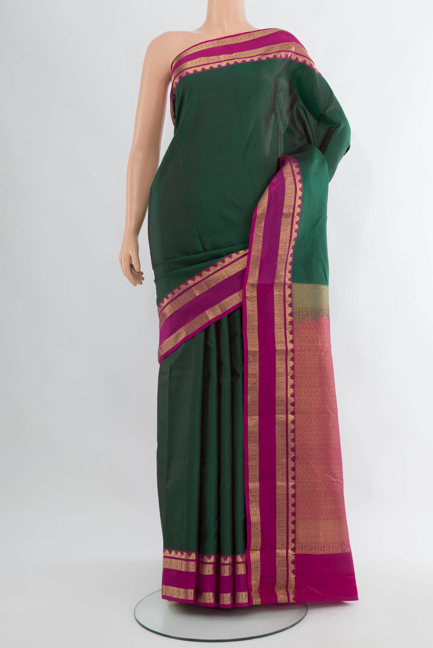 Bottle Green Kanchipuram Silk Saree with Checked design on the body and Zari Border.  displayed on a mannequin