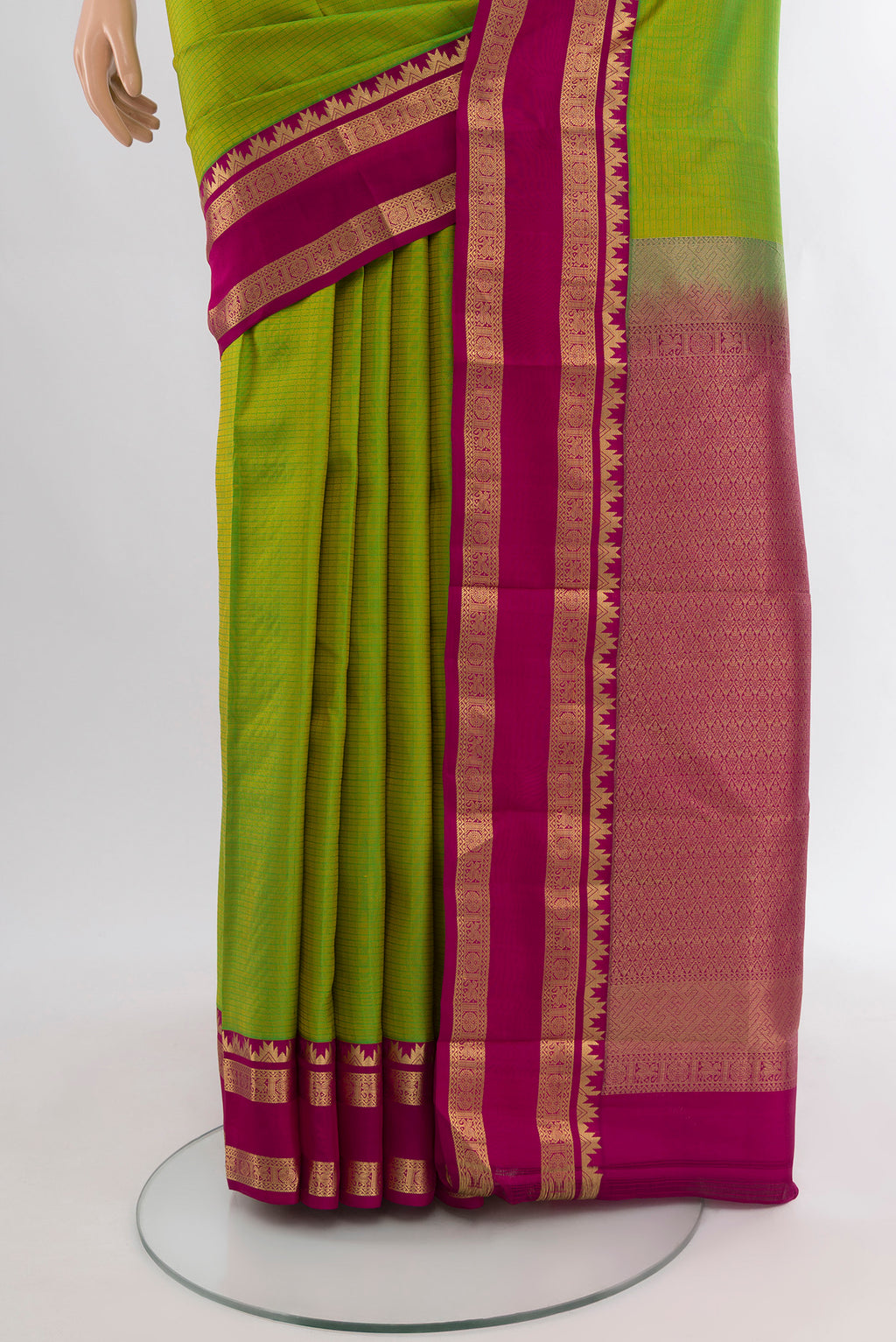 Pleats and pallu of Parrot Green Kanchipuram Silk Saree with Checked design on the body and Zari Border. 
