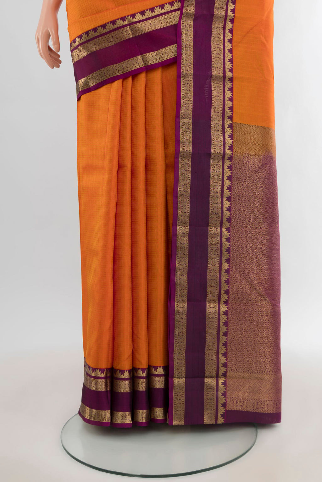 Pleats and pallu of Yellow Kanchipuram Silk Saree with Checked design on the body and Zari Border. 