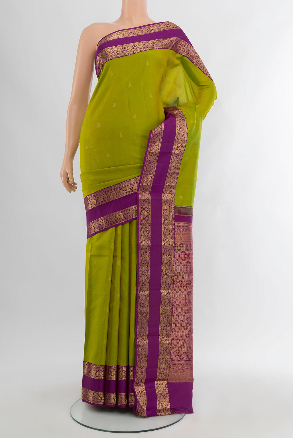 Mehandi Green Kanchipuram Silk Saree with Zari Butta on the body and Zari Border.  displayed on a mannequin