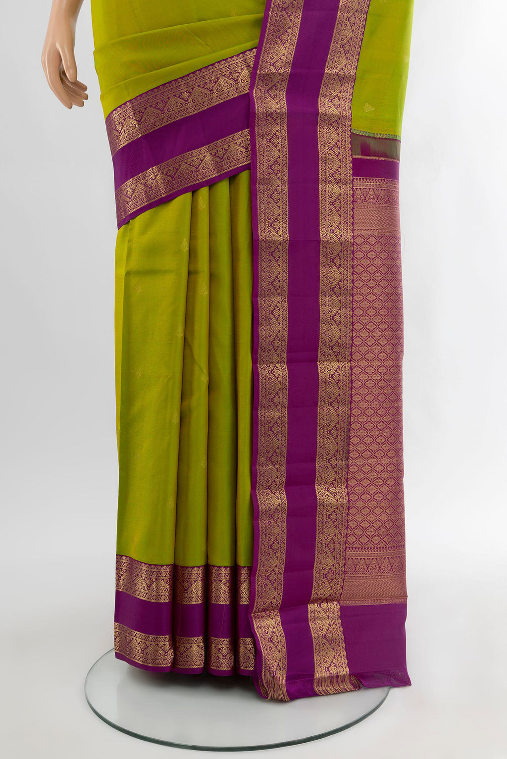Pleats and pallu of Mehandi Green Kanchipuram Silk Saree with Zari Butta on the body and Zari Border. 