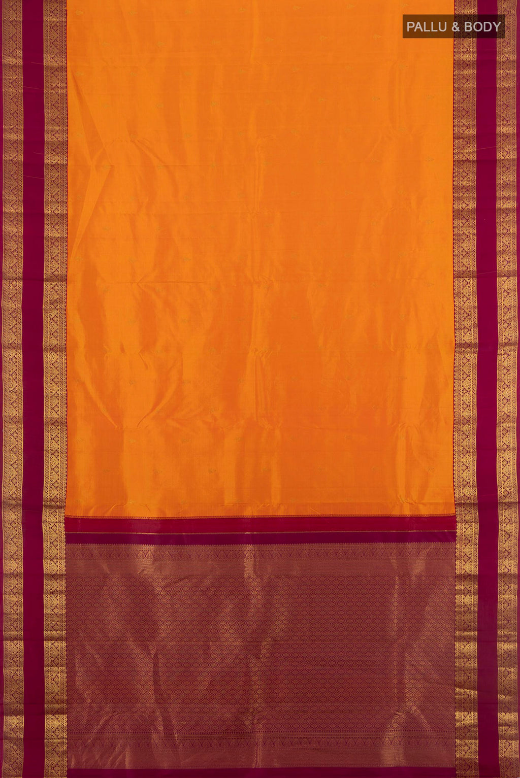 Flat view of Orange Kanchipuram Silk Saree with Zari Butta on the body and Zari Border. 