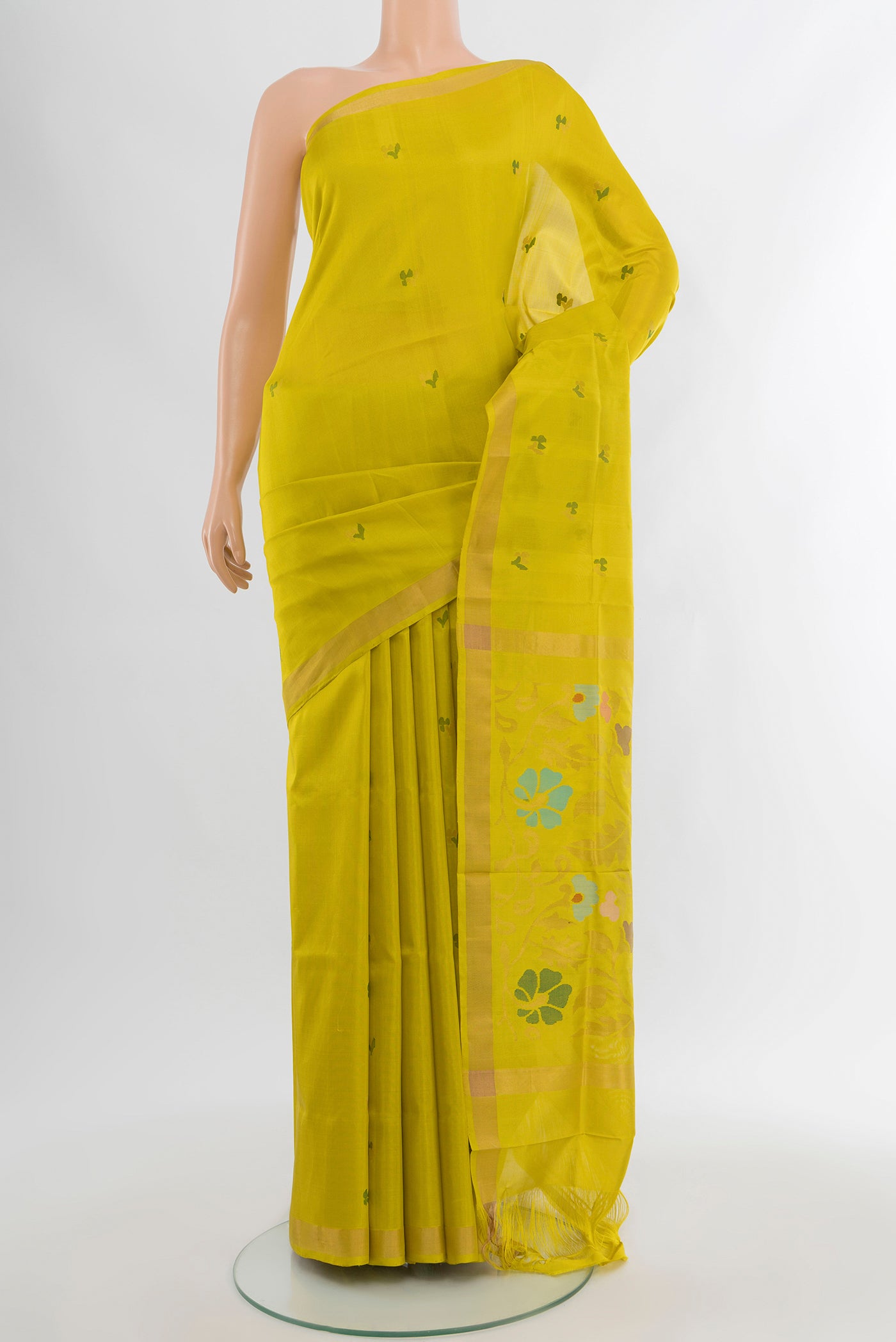 Light Green Uppada Silk Saree with Zari Butta on the body and Silk Border.  displayed on a mannequin