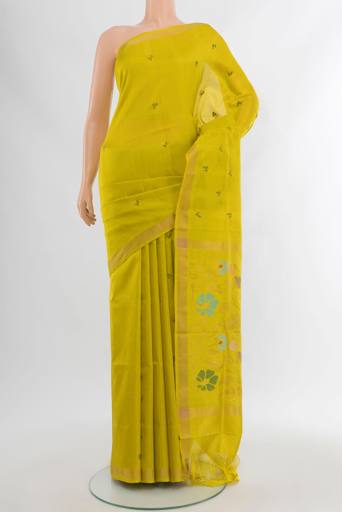 Light Green Uppada Silk Saree with Zari Butta on the body and Silk Border.  displayed on a mannequin