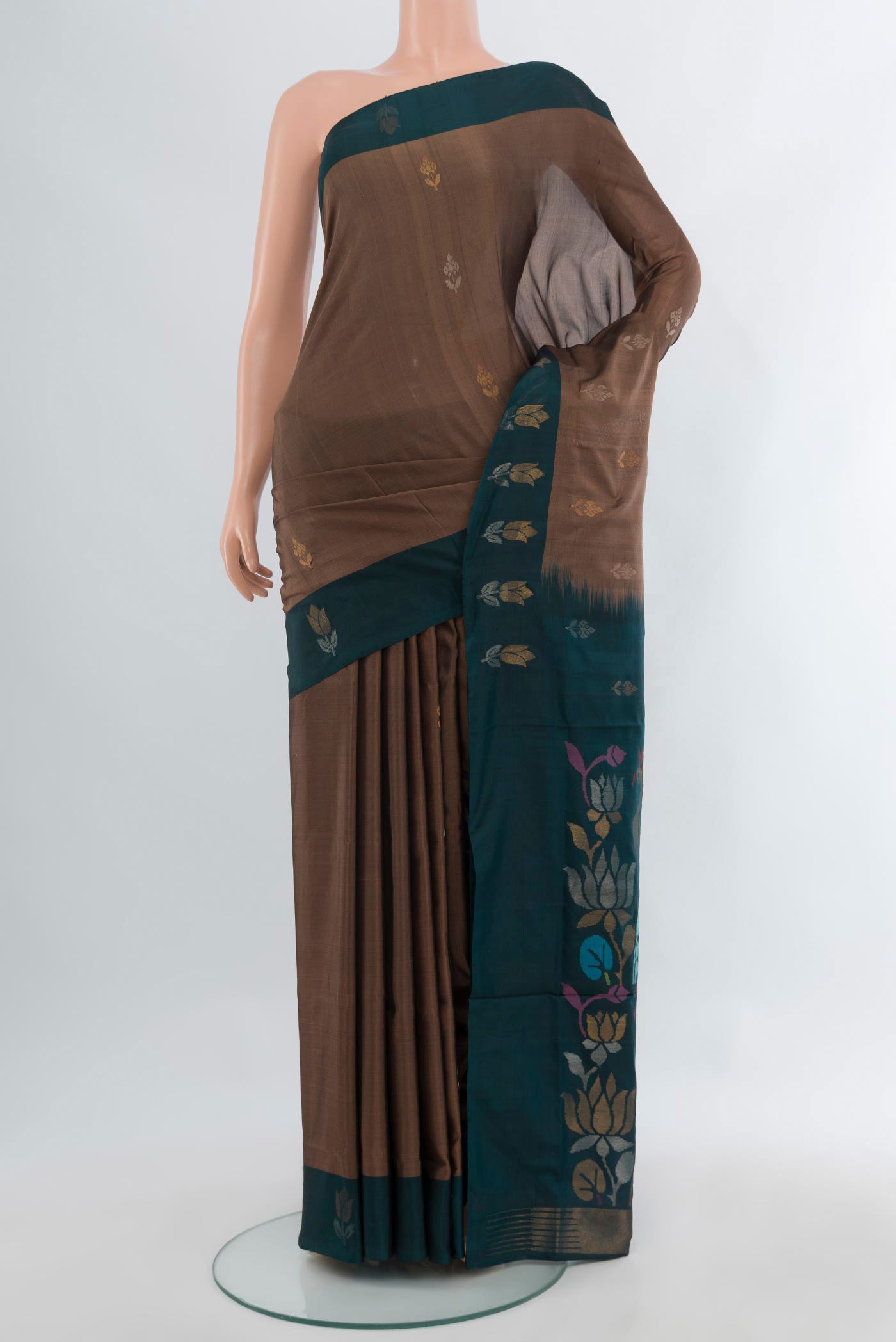 Brown Uppada Silk Saree with Zari Butta on the body and Plain Border.  displayed on a mannequin