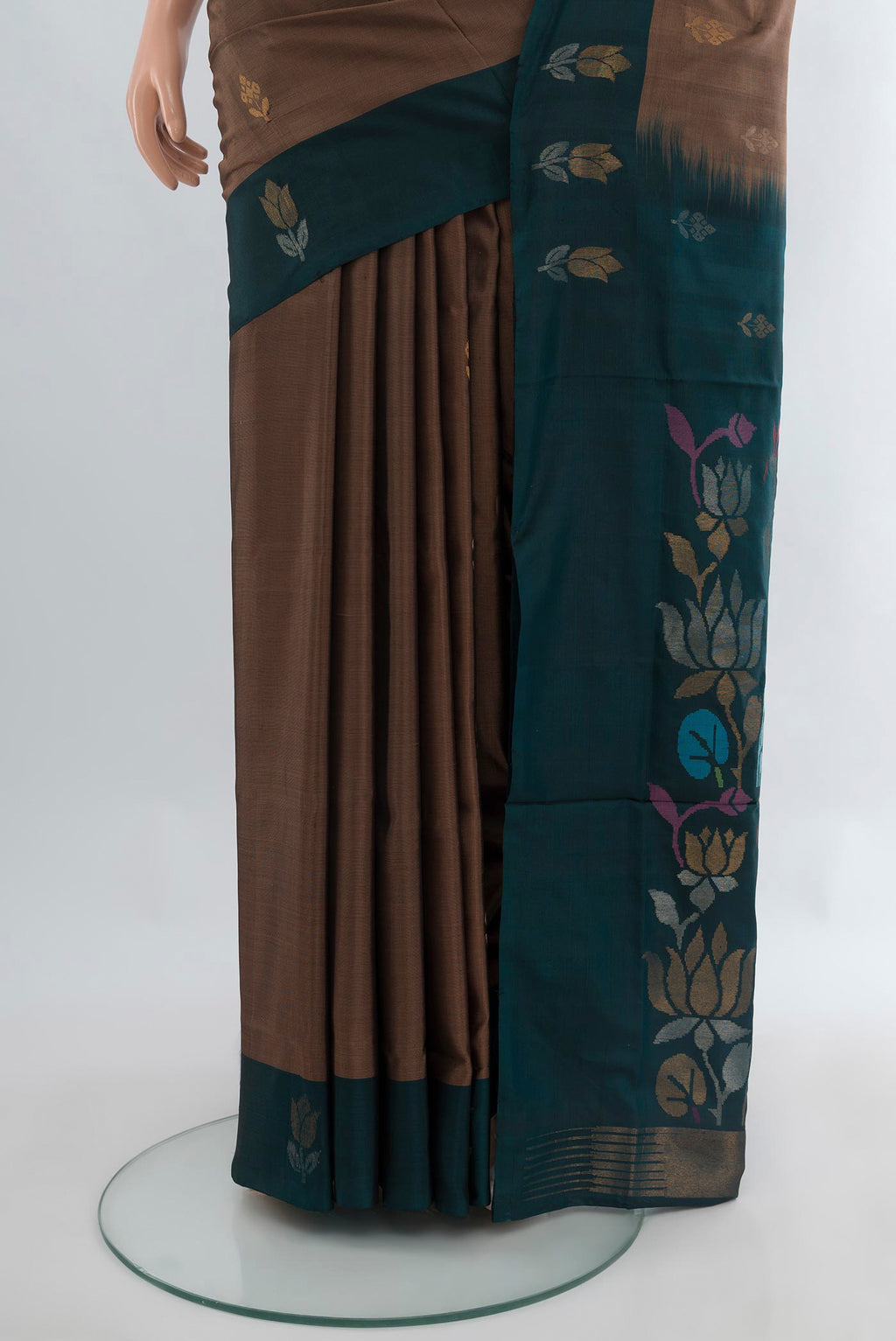 Pleats and pallu of Brown Uppada Silk Saree with Zari Butta on the body and Plain Border. 