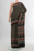 Black Satin Crepe Saree with Floral Print on the body and Printed Border.  displayed on a mannequin