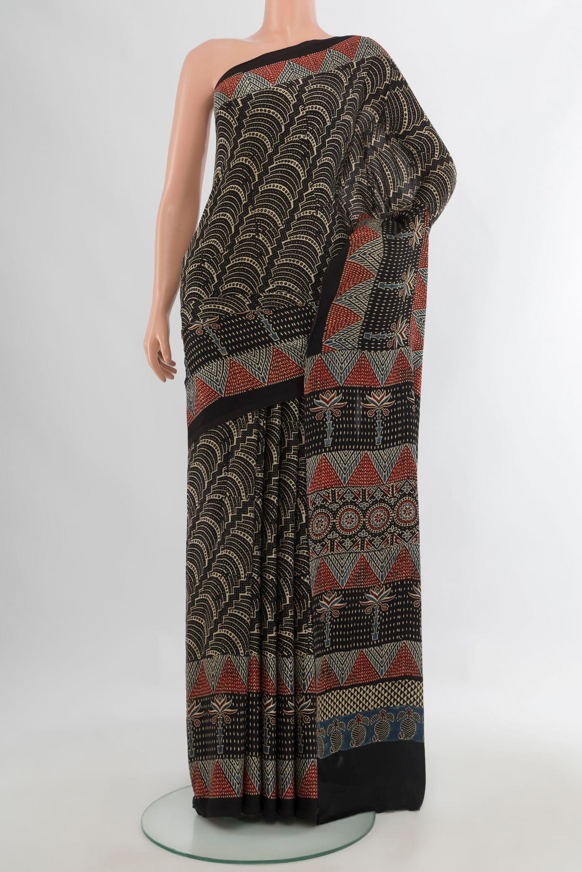 Black Satin Crepe Saree with Floral Print on the body and Printed Border.  displayed on a mannequin
