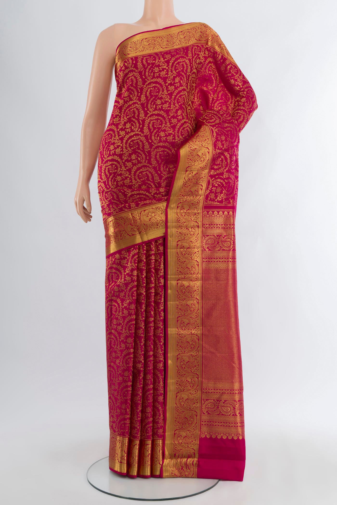 Dark Pink Kanchipuram Silk Saree with Zari Brocade on the body and Zari Border.  displayed on a mannequin