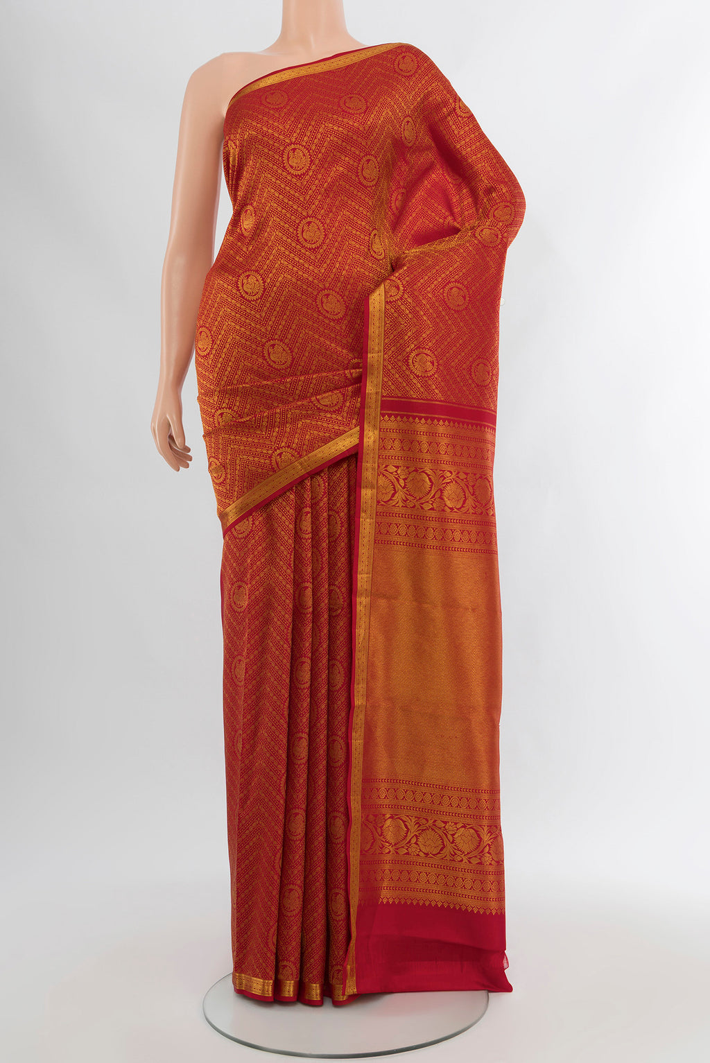 Pure Silk Pure Zari Red Kanchipuram Saree with Zari Butta on the body and Silk Border.  displayed on a mannequin