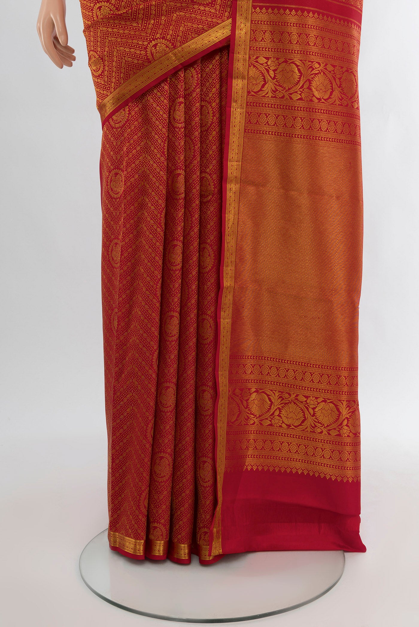 Pleats and pallu of Pure Silk Pure Zari Red Kanchipuram Saree with Zari Butta on the body and Silk Border. 