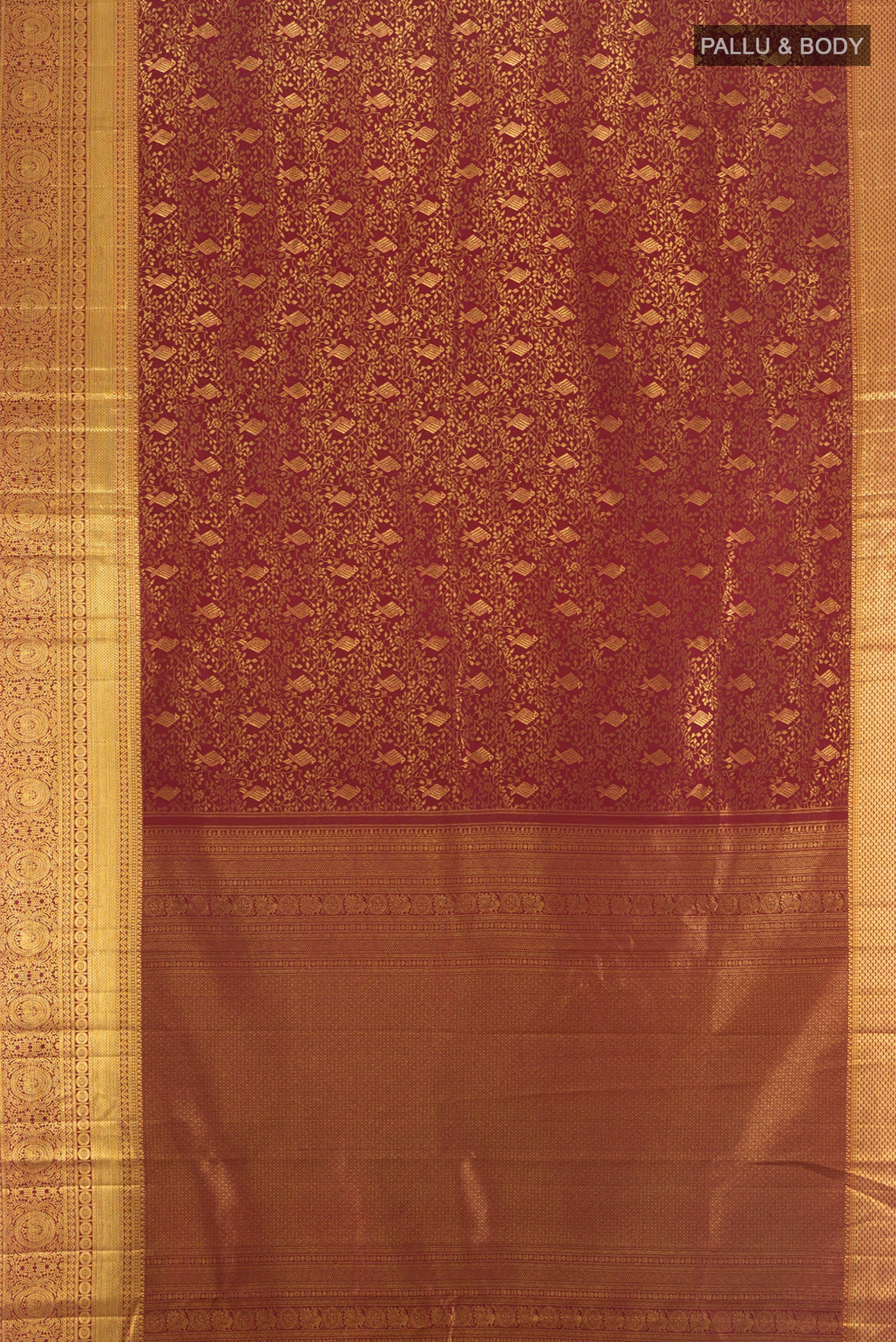 Flat view of Pure Silk Pure Zari Maroon Kanchipuram Saree with Zari Butta on the body and Silk Border. 