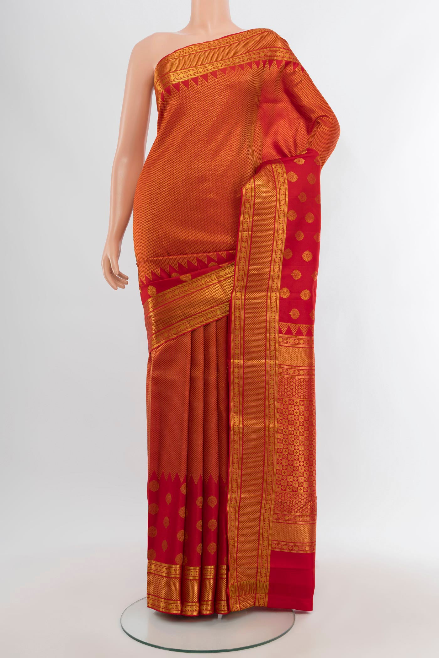 Red Kanchipuram Silk Saree with Zari Brocade on the body and Zari Border.  displayed on a mannequin