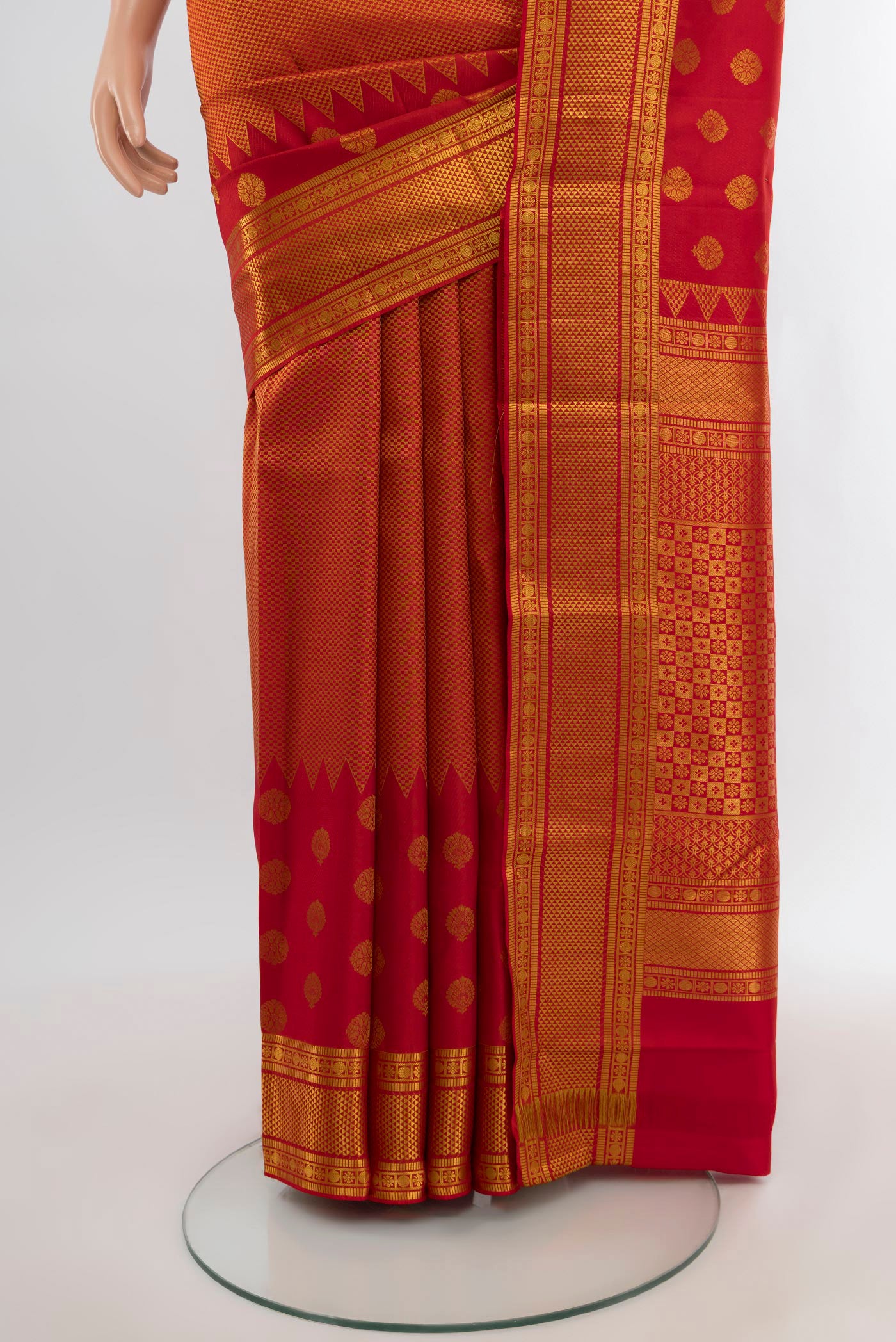 Pleats and pallu of Red Kanchipuram Silk Saree with Zari Brocade on the body and Zari Border. 