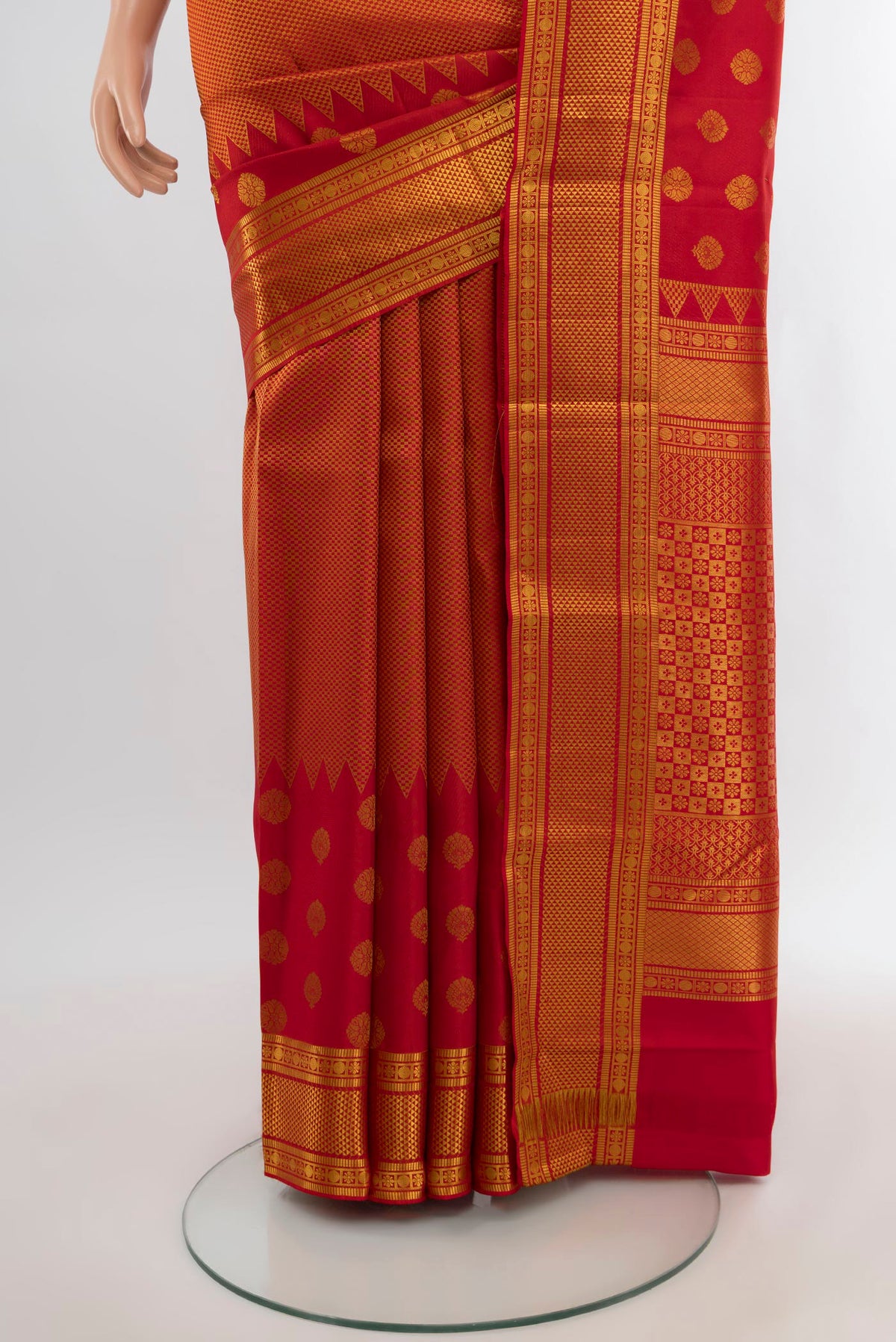 Pleats and pallu of Red Kanchipuram Silk Saree with Zari Brocade on the body and Zari Border. 