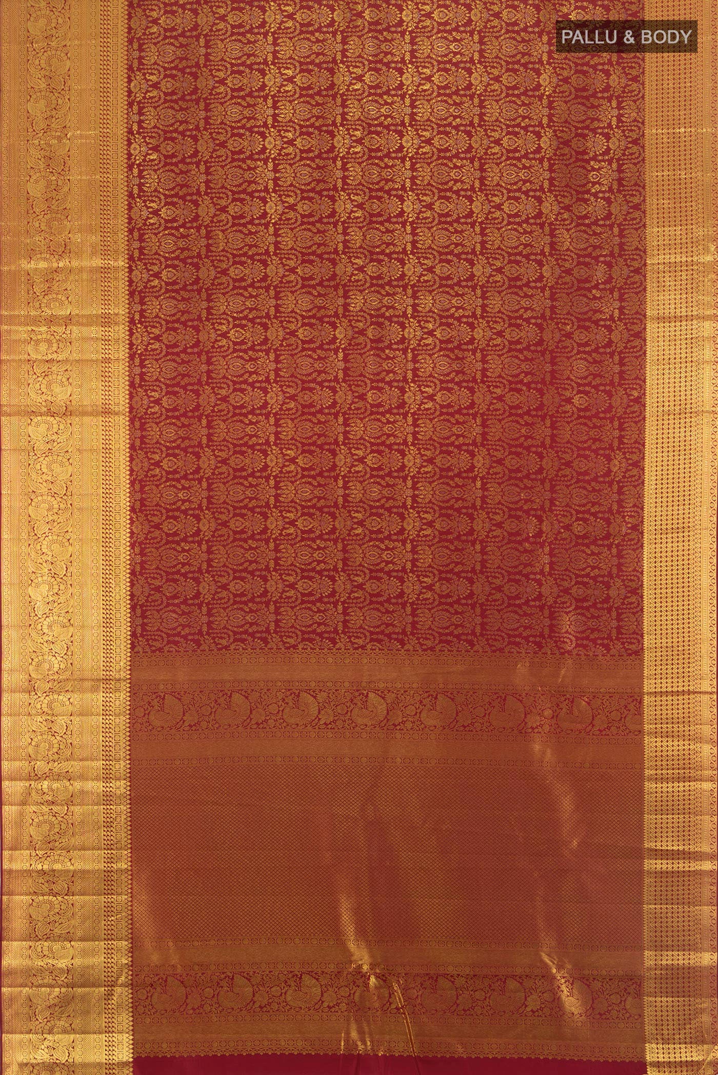 Flat view of Maroon Kanjivaram Silk Saree with Zari Brocade on the body and Zari Border. 