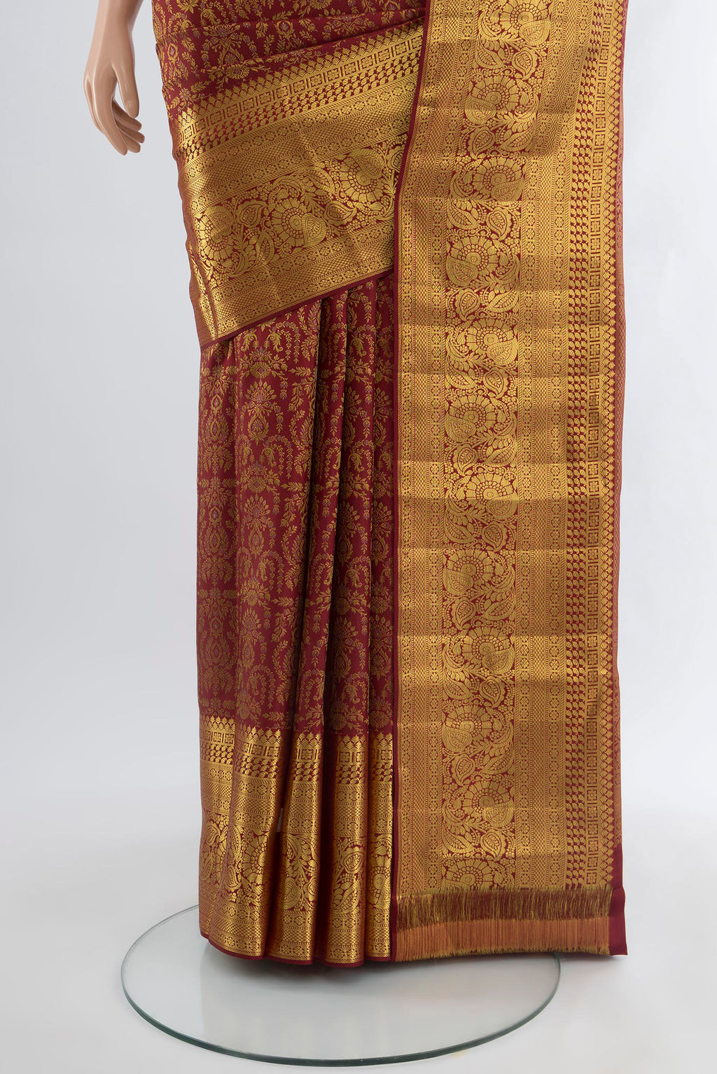 Pleats and pallu of Maroon Kanjivaram Silk Saree with Zari Brocade on the body and Zari Border. 