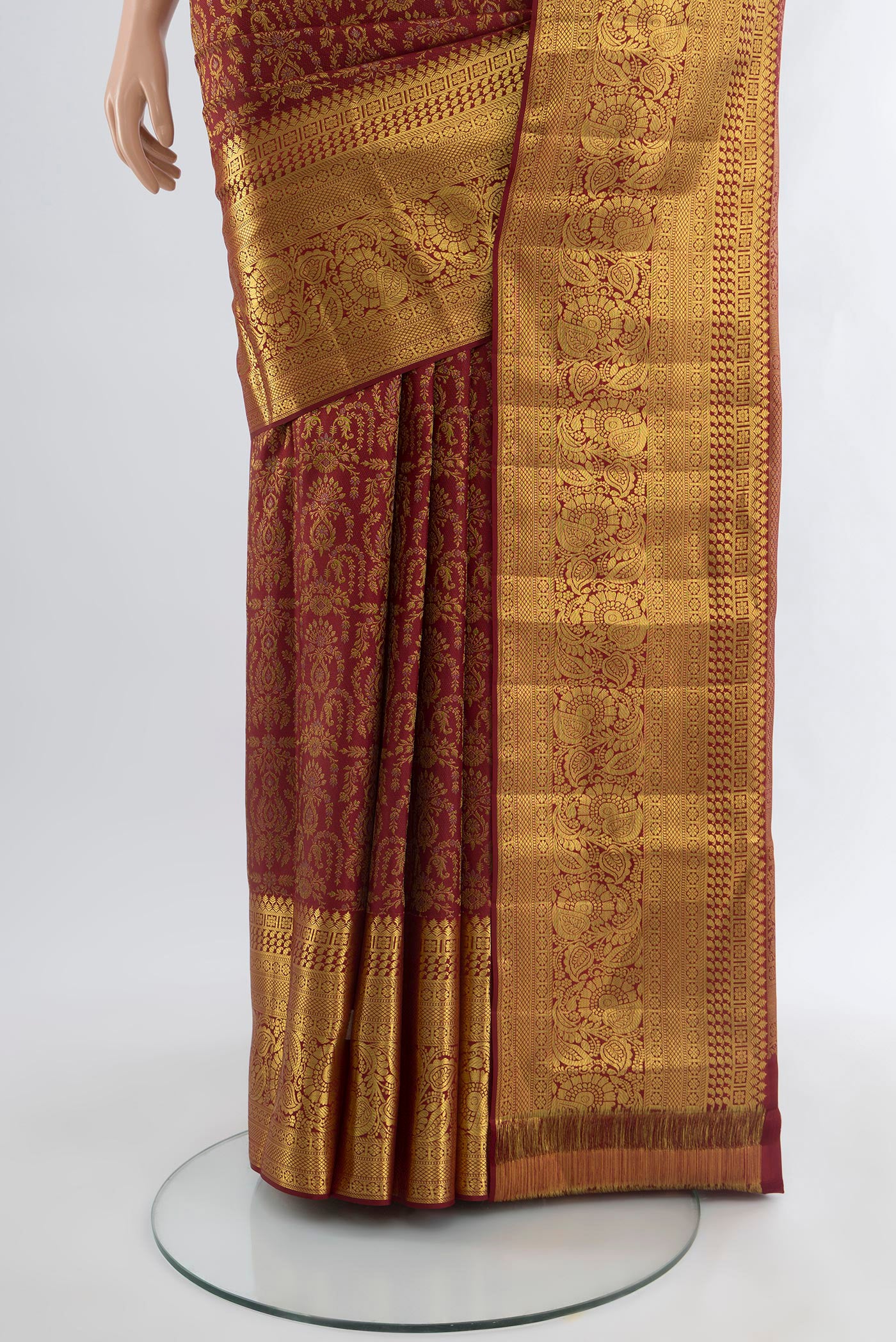 Pleats and pallu of Maroon Kanjivaram Silk Saree with Zari Brocade on the body and Zari Border. 