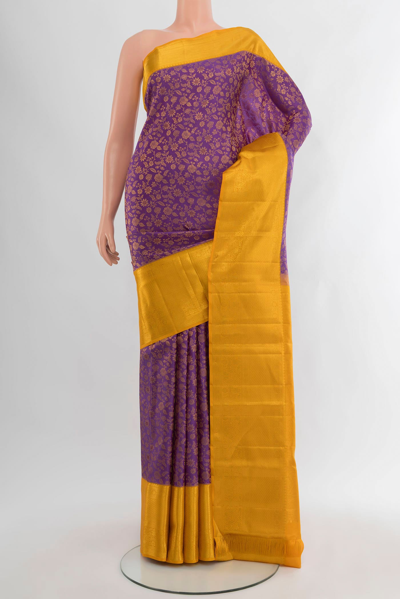 Lavender Kanjivaram Silk Saree with Zari Brocade on the body and Zari Border.  displayed on a mannequin