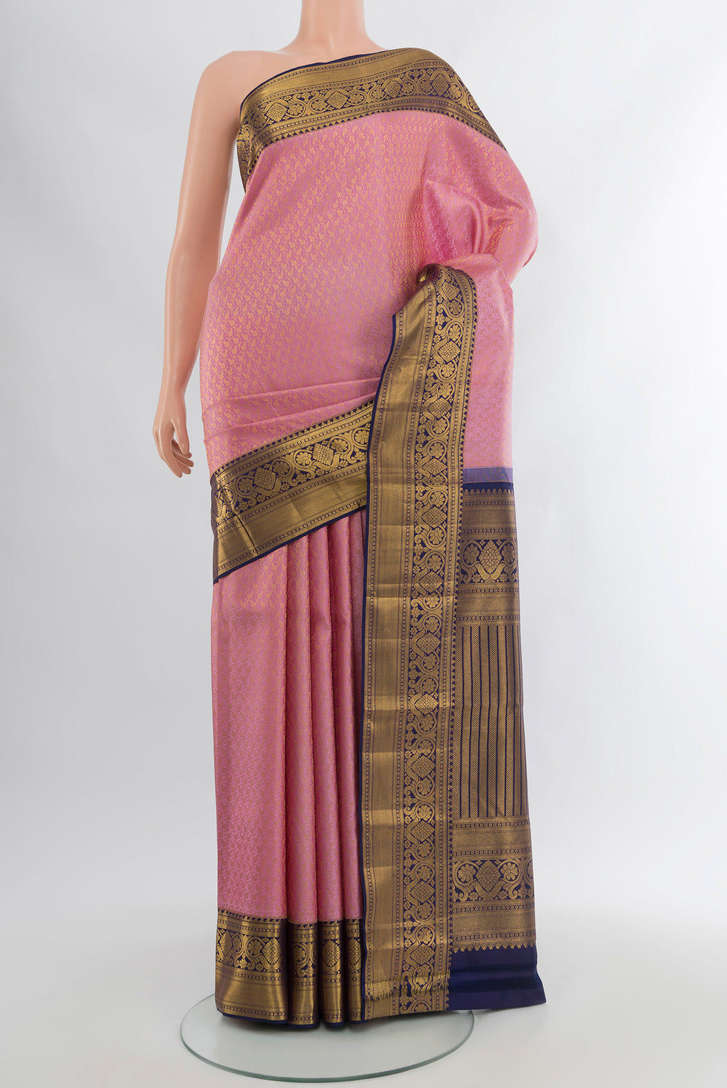 Pure Silk Pure Zari Rose Gold Kanjivaram Saree with Zari Butta on the body and Silk Border.  displayed on a mannequin