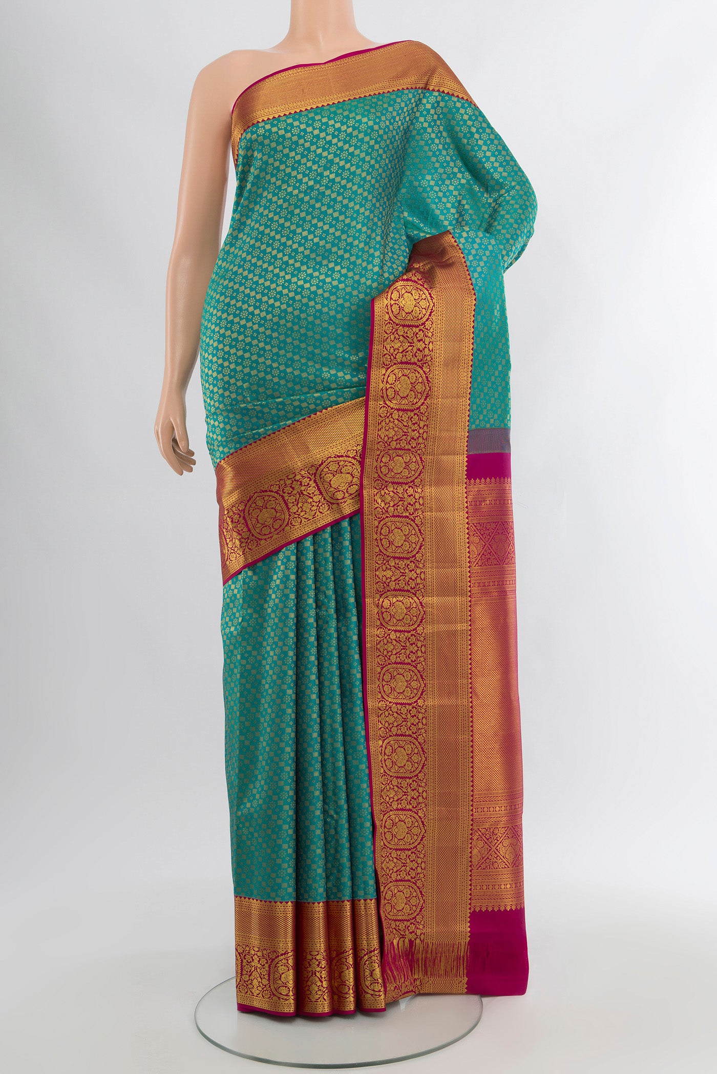 Pure Silk Pure Zari Peacock Blue Kanjivaram Saree with Zari Butta on the body and Silk Border.  displayed on a mannequin