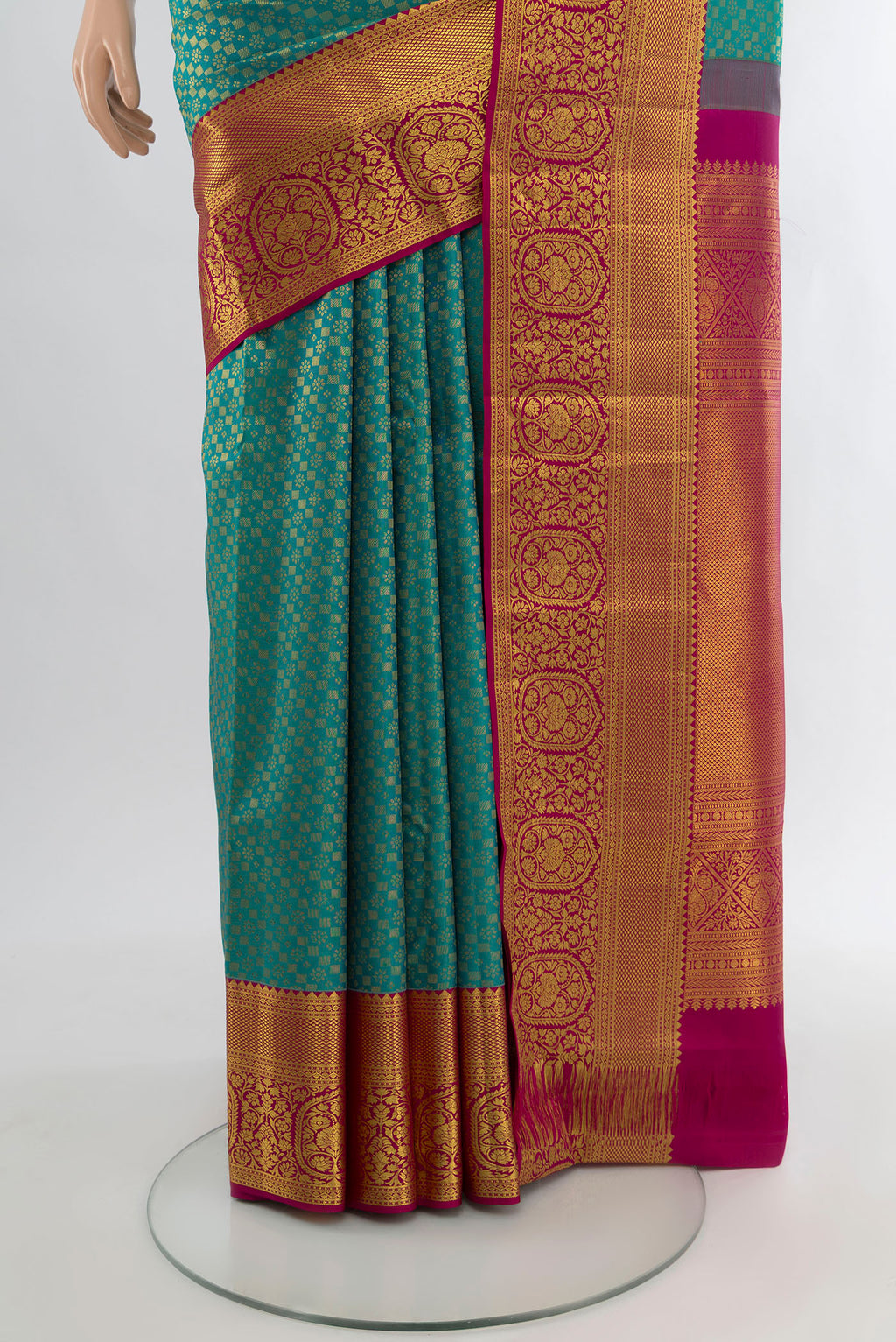 Pleats and pallu of Pure Silk Pure Zari Peacock Blue Kanjivaram Saree with Zari Butta on the body and Silk Border. 