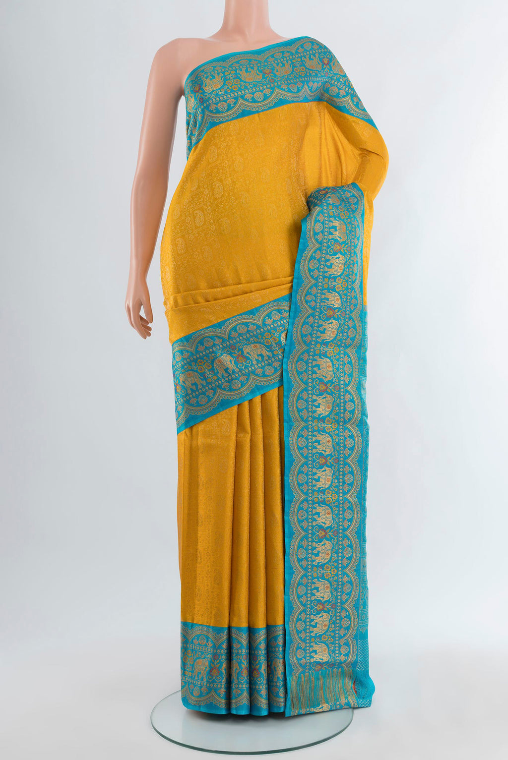 Yellow Kanjivaram Silk Saree with Zari Brocade on the body and Zari Border.  displayed on a mannequin