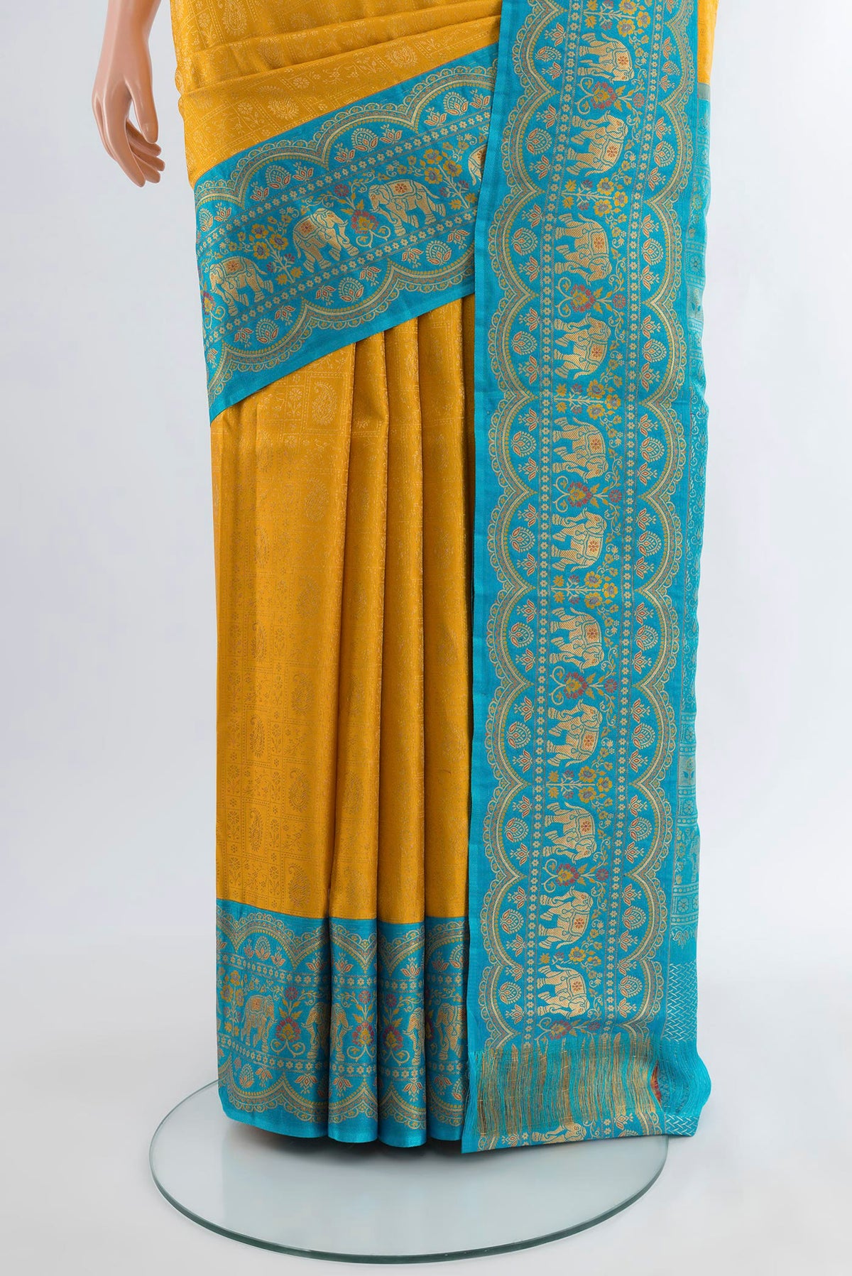 Pleats and pallu of Yellow Kanjivaram Silk Saree with Zari Brocade on the body and Zari Border. 