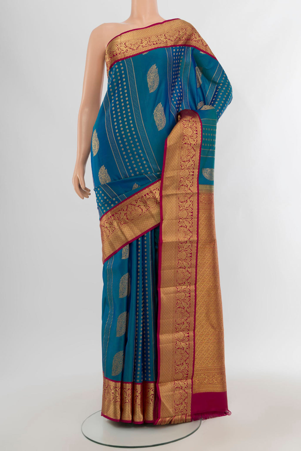 Blue Kanjivaram Silk Saree with Zari Butta on the body and Zari Border.  displayed on a mannequin