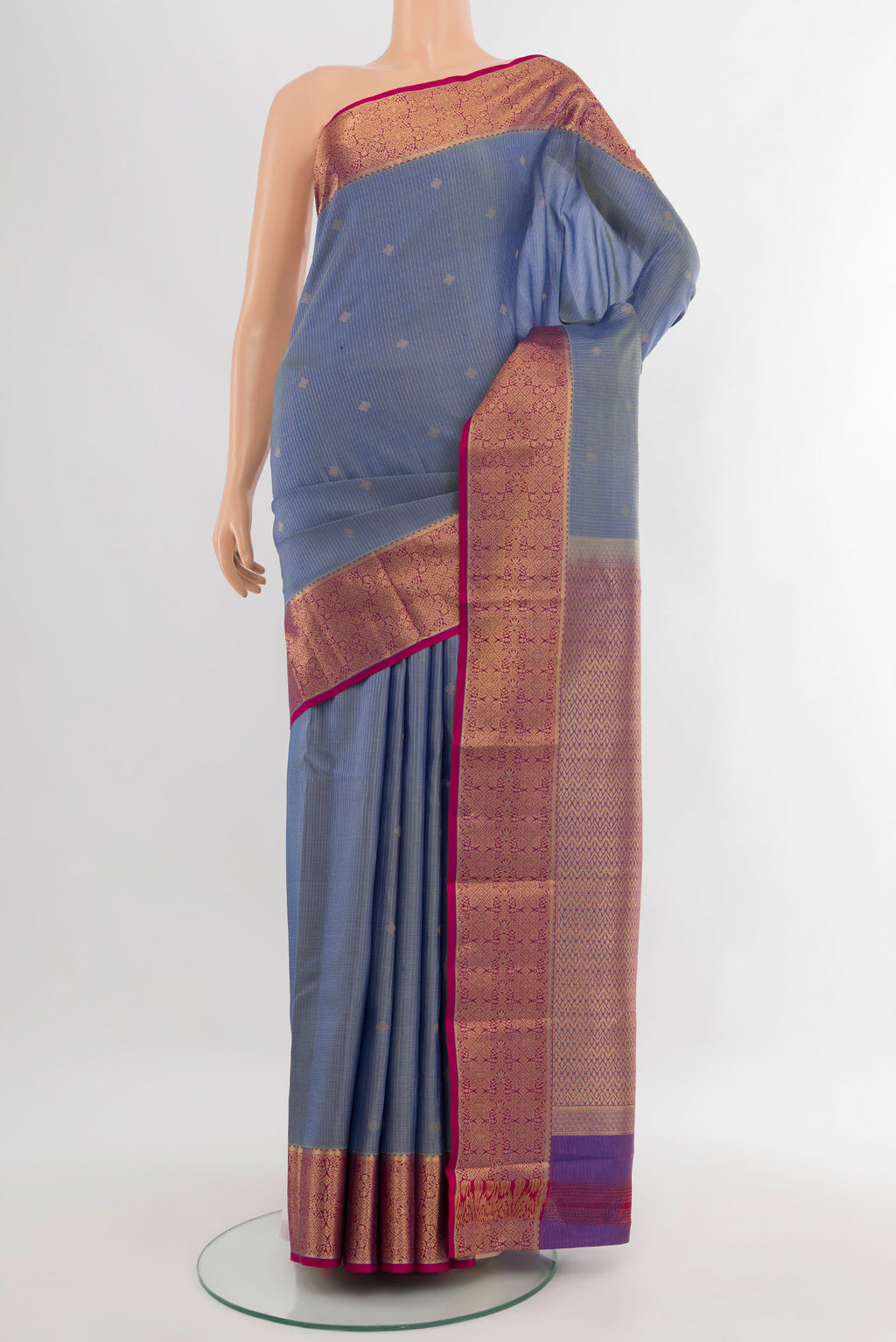 Blue Kanjivaram Silk Saree with Zari Butta on the body and Zari Border.  displayed on a mannequin