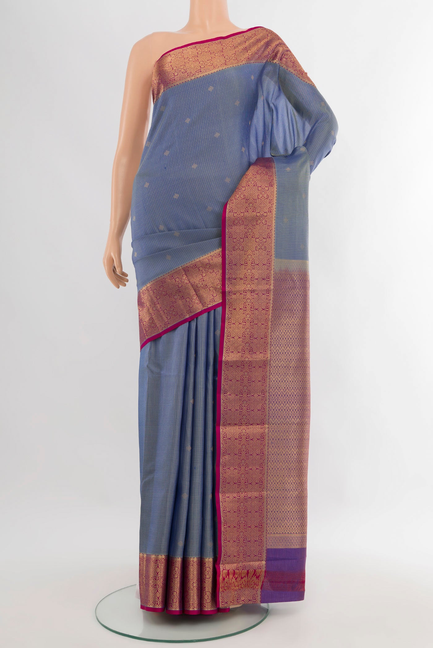 Blue Kanjivaram Silk Saree with Zari Butta on the body and Zari Border.  displayed on a mannequin