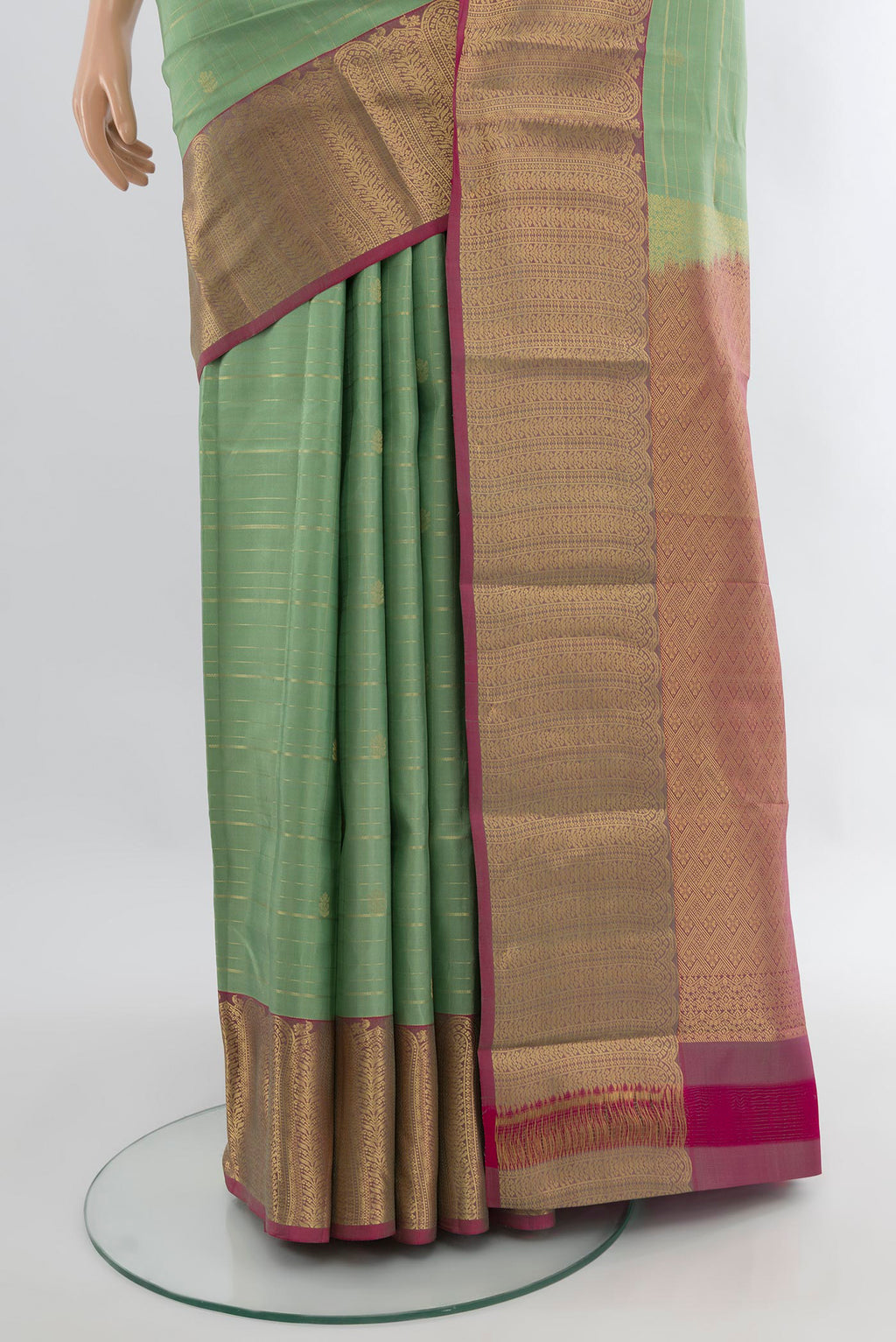 Pleats and pallu of Pista Green Kanjivaram Silk Saree with Zari Butta on the body and Zari Border. 