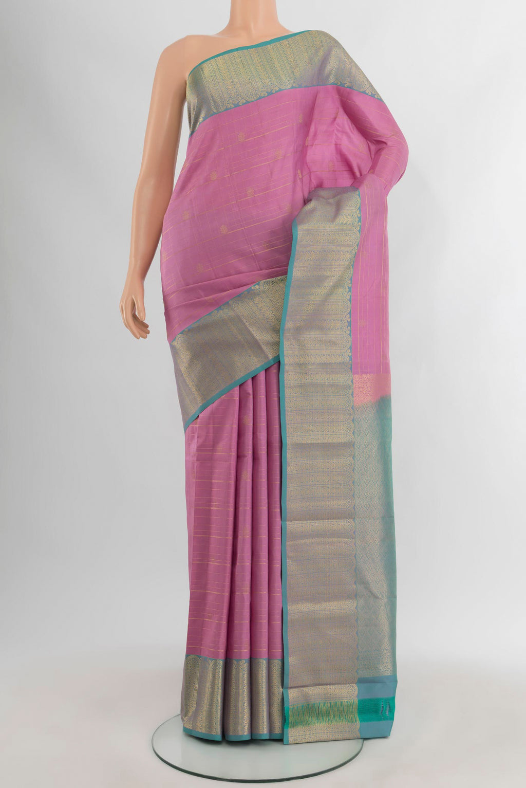 Rose pink Kanjivaram Silk Saree with Zari Butta on the body and Zari Border.  displayed on a mannequin