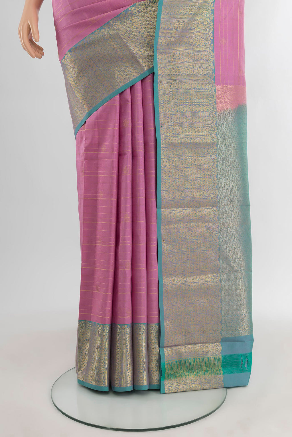 Pleats and pallu of Rose pink Kanjivaram Silk Saree with Zari Butta on the body and Zari Border. 