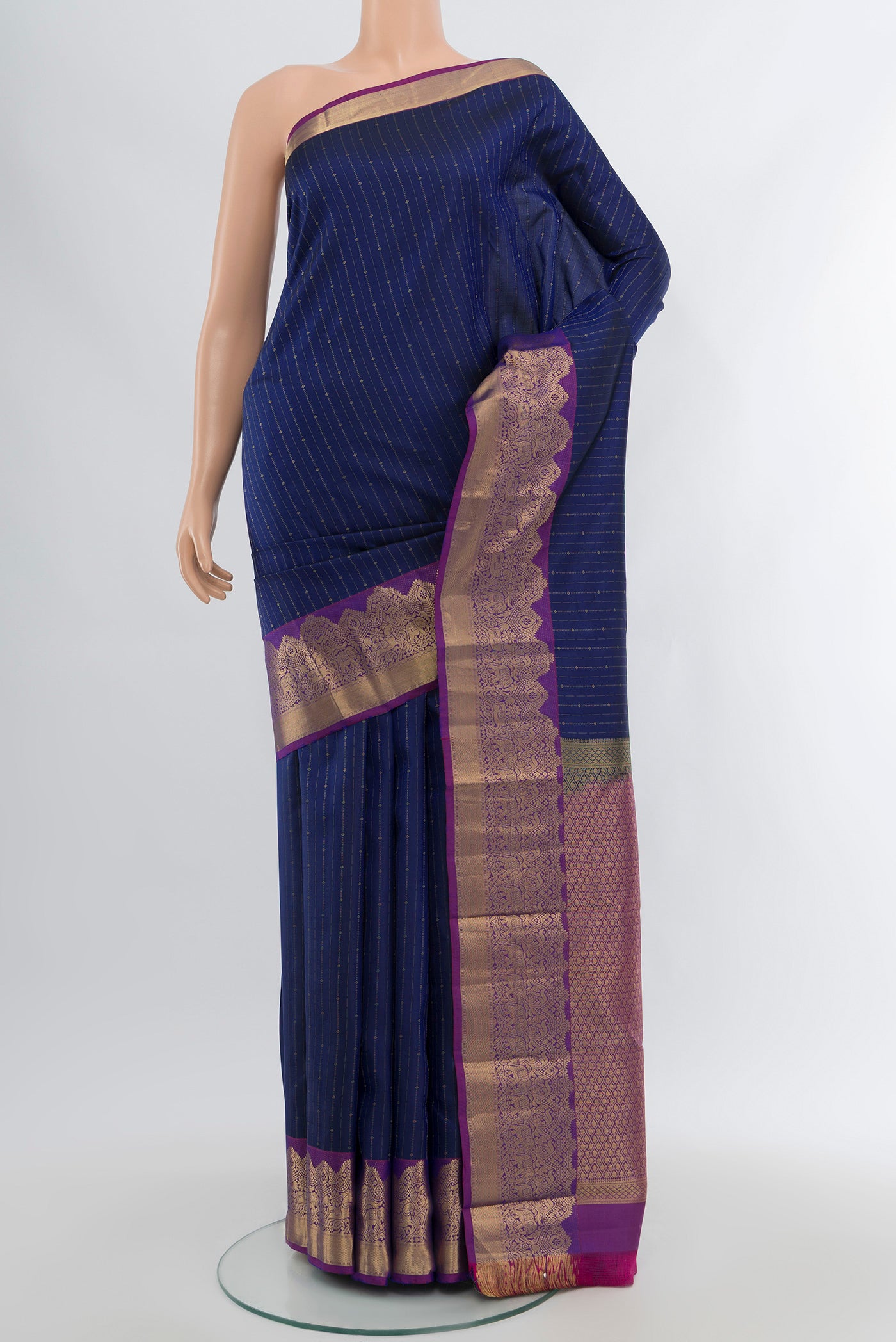 Blue Kanchipuram Silk Saree with Stripes on the body and Zari Border.  displayed on a mannequin