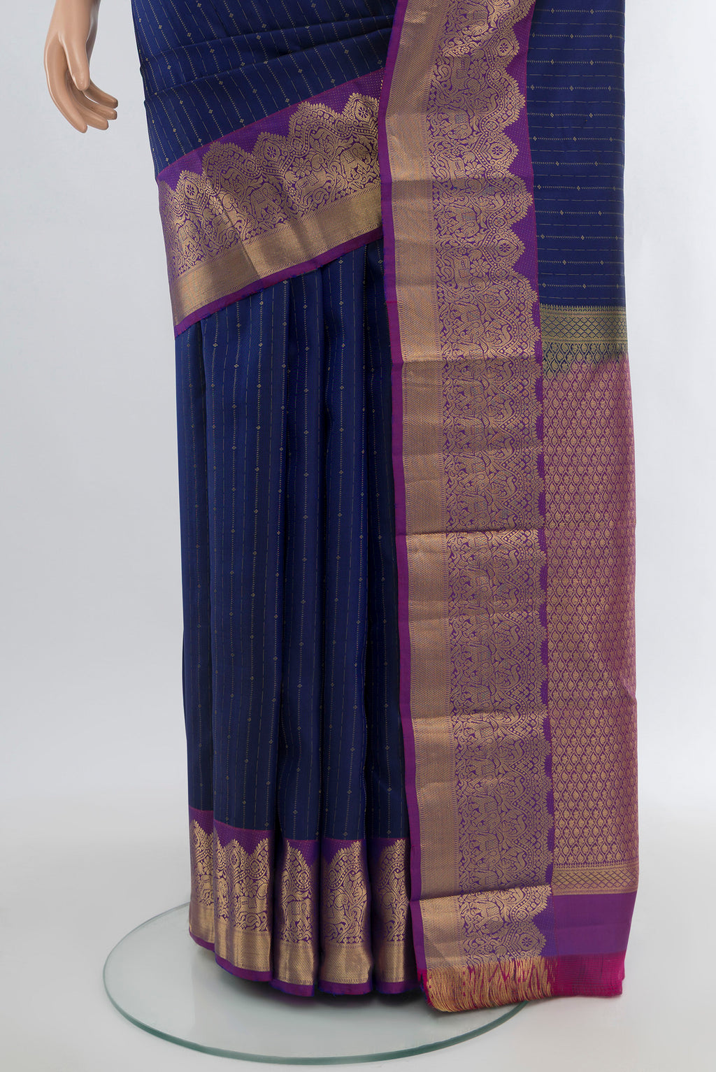 Pleats and pallu of Blue Kanchipuram Silk Saree with Stripes on the body and Zari Border. 