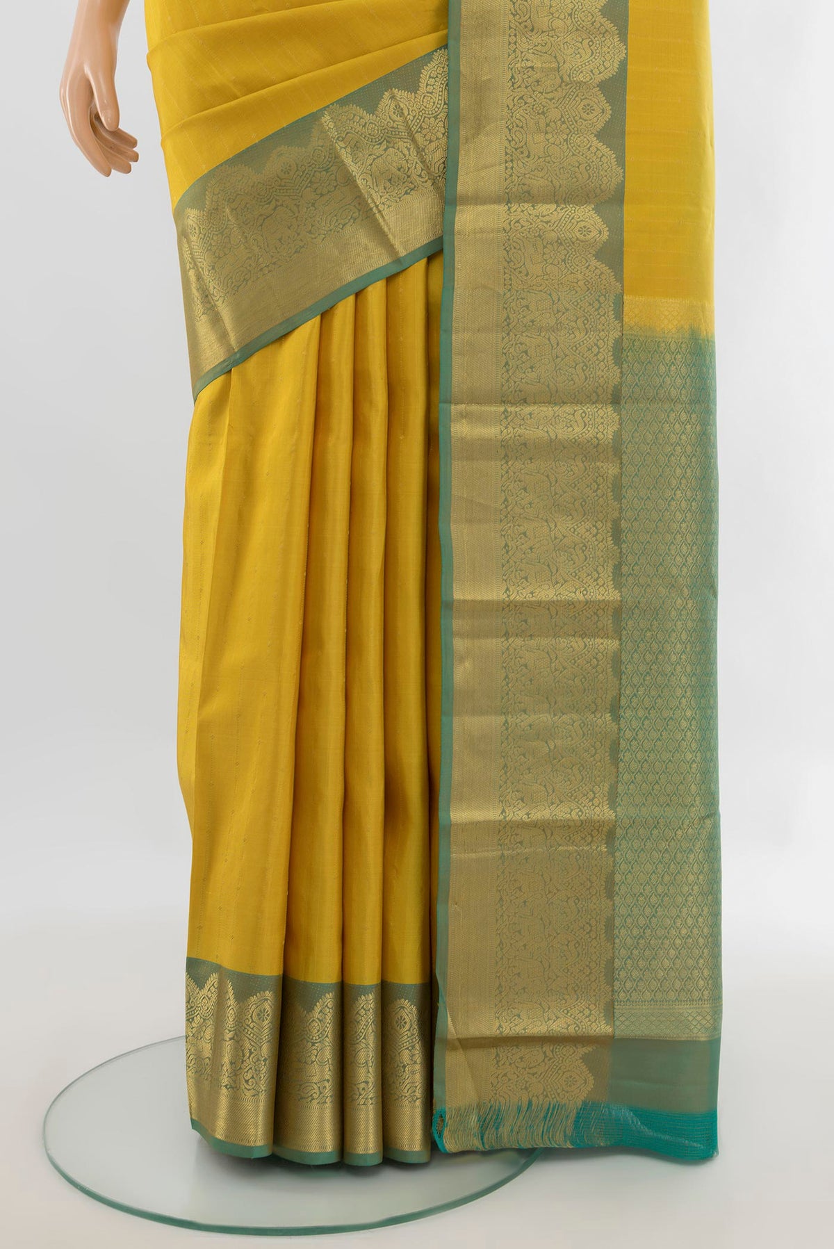 Pleats and pallu of Pure Silk Yellow Kanchipuram Saree with Stripes on the body and Zari Border. 