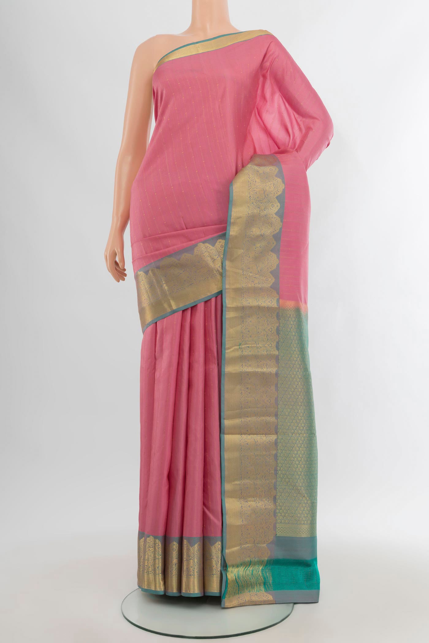 Rose pink Kanchipuram Silk Saree with Zari Butta on the body and Zari Border.  displayed on a mannequin