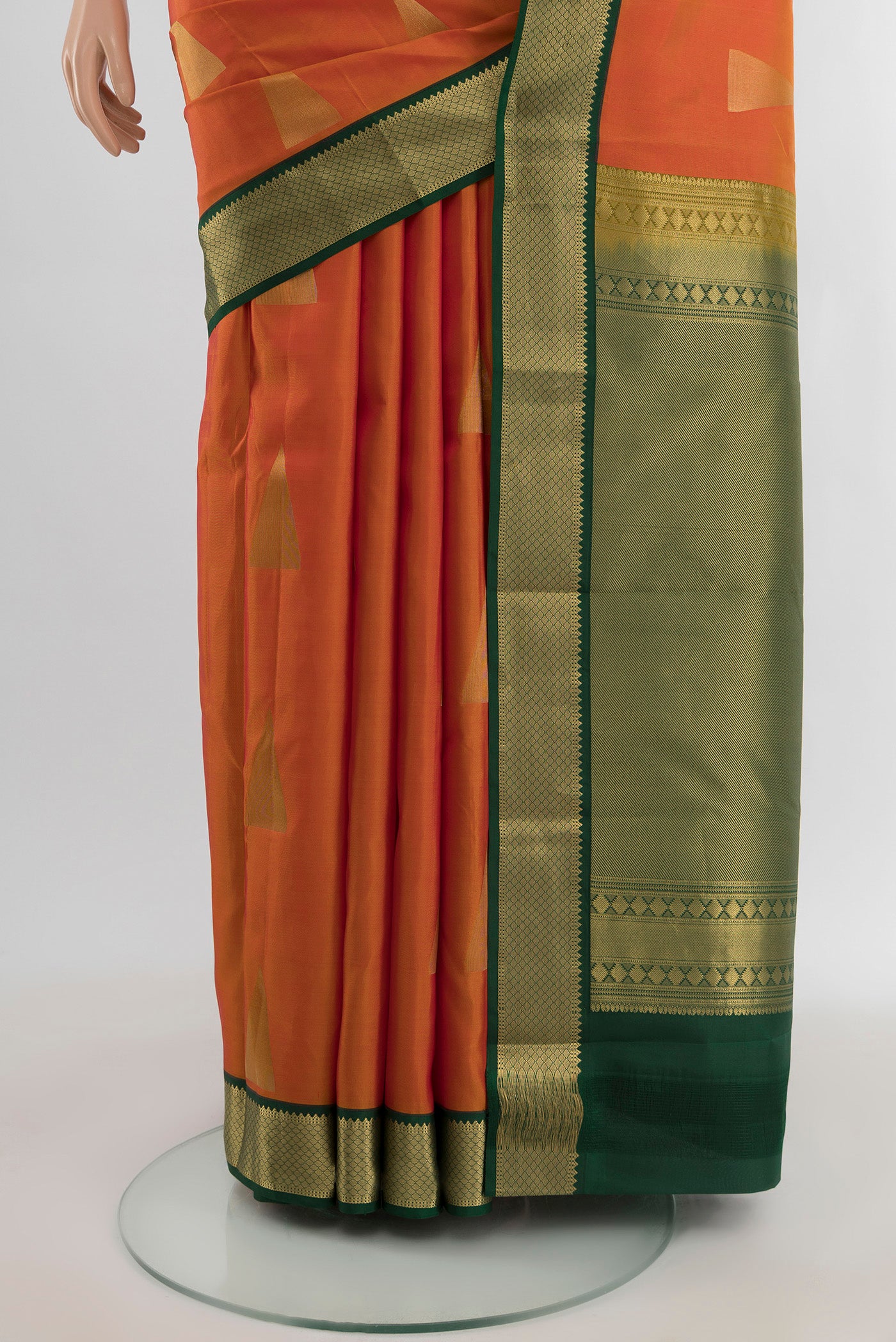 Pleats and pallu of Orange Kanchipuram Silk Saree with Zari Butta on the body and Zari Border. 