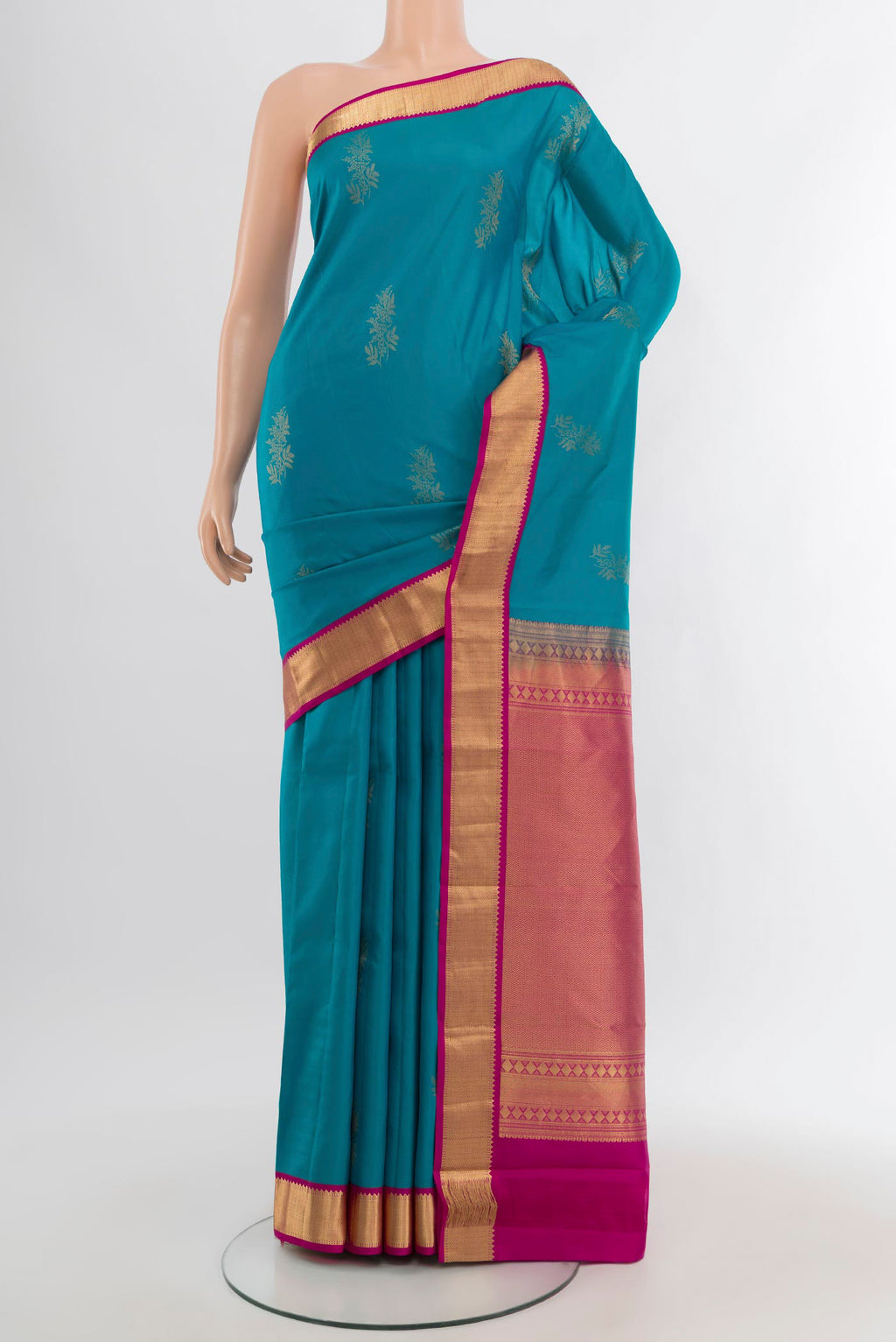 Blue Kanchipuram Silk Saree with Zari Butta on the body and Zari Border.  displayed on a mannequin