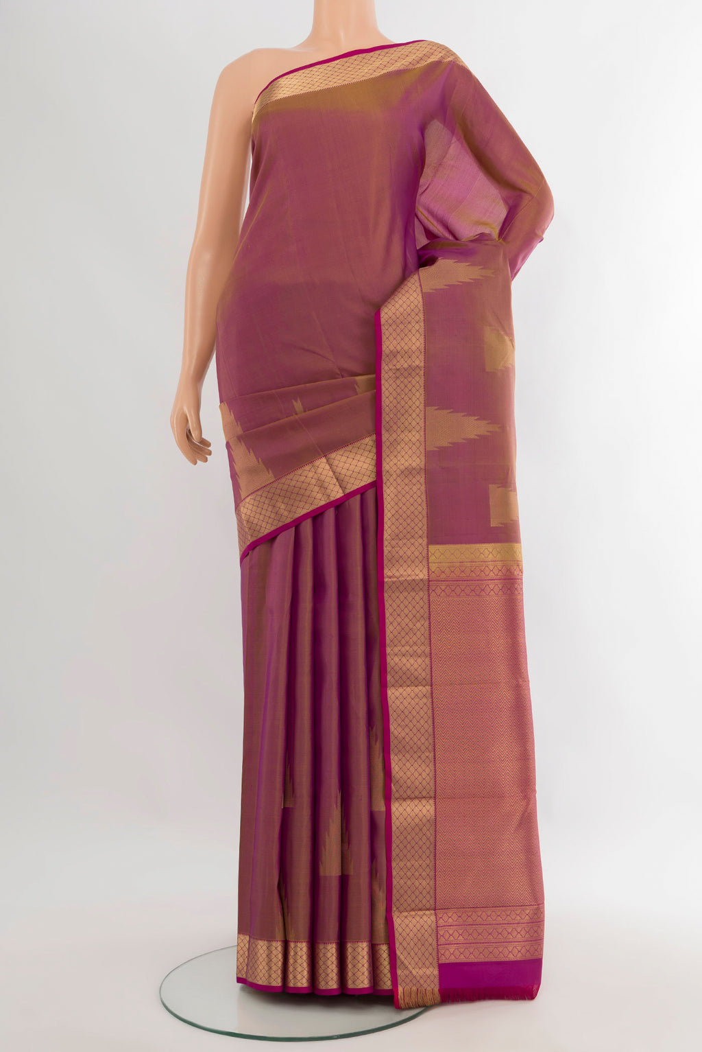 Magenta Kanchipuram Silk Saree with Plain Body and Zari Border.  displayed on a mannequin