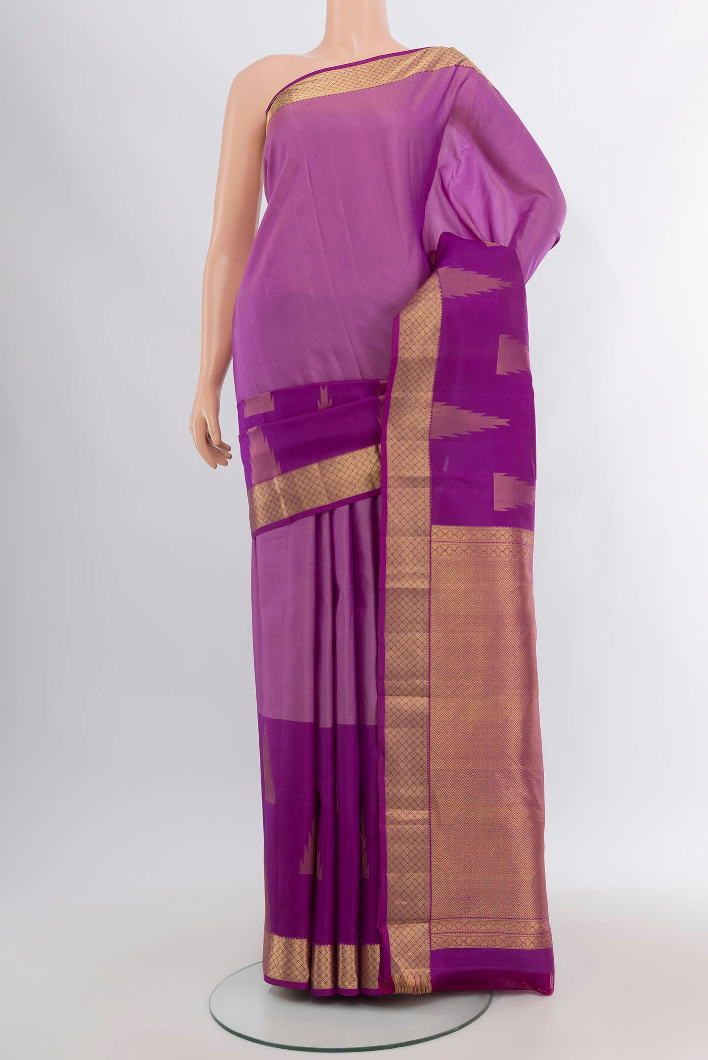Lavender Kanchipuram Silk Saree with Plain Body and Zari Border.  displayed on a mannequin