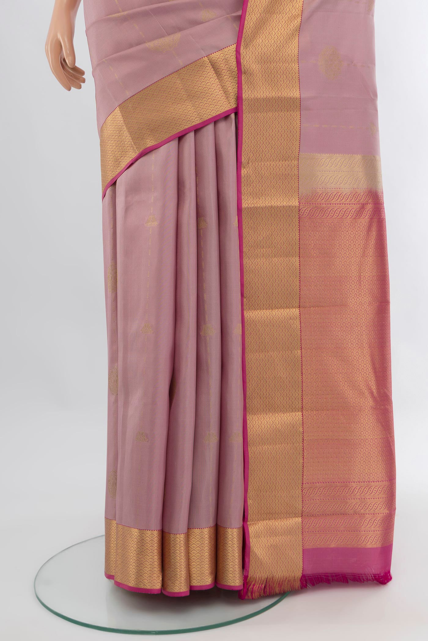 Pleats and pallu of Lavender Kanchipuram Silk Saree with Zari Butta on the body and Zari Border. 