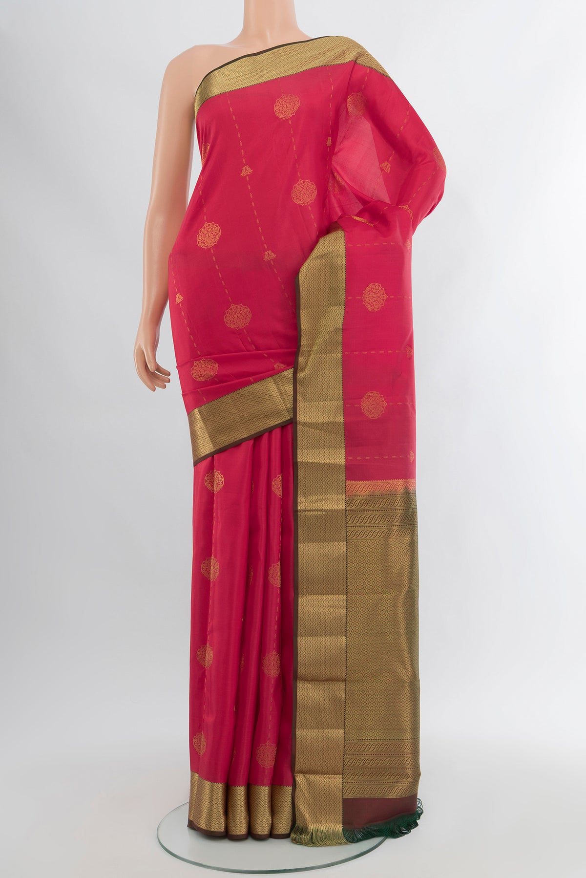 Pink Kanchipuram Silk Saree with Zari Butta on the body and Zari Border.  displayed on a mannequin
