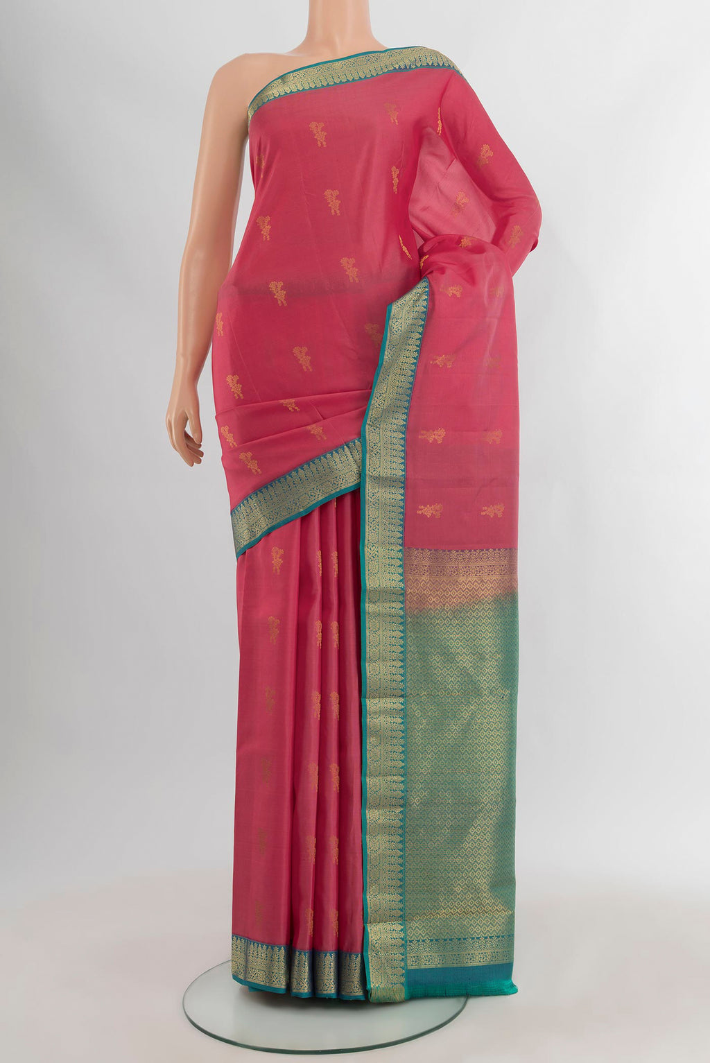 Pink Kanchipuram Silk Saree with Zari Butta on the body and Zari Border.  displayed on a mannequin